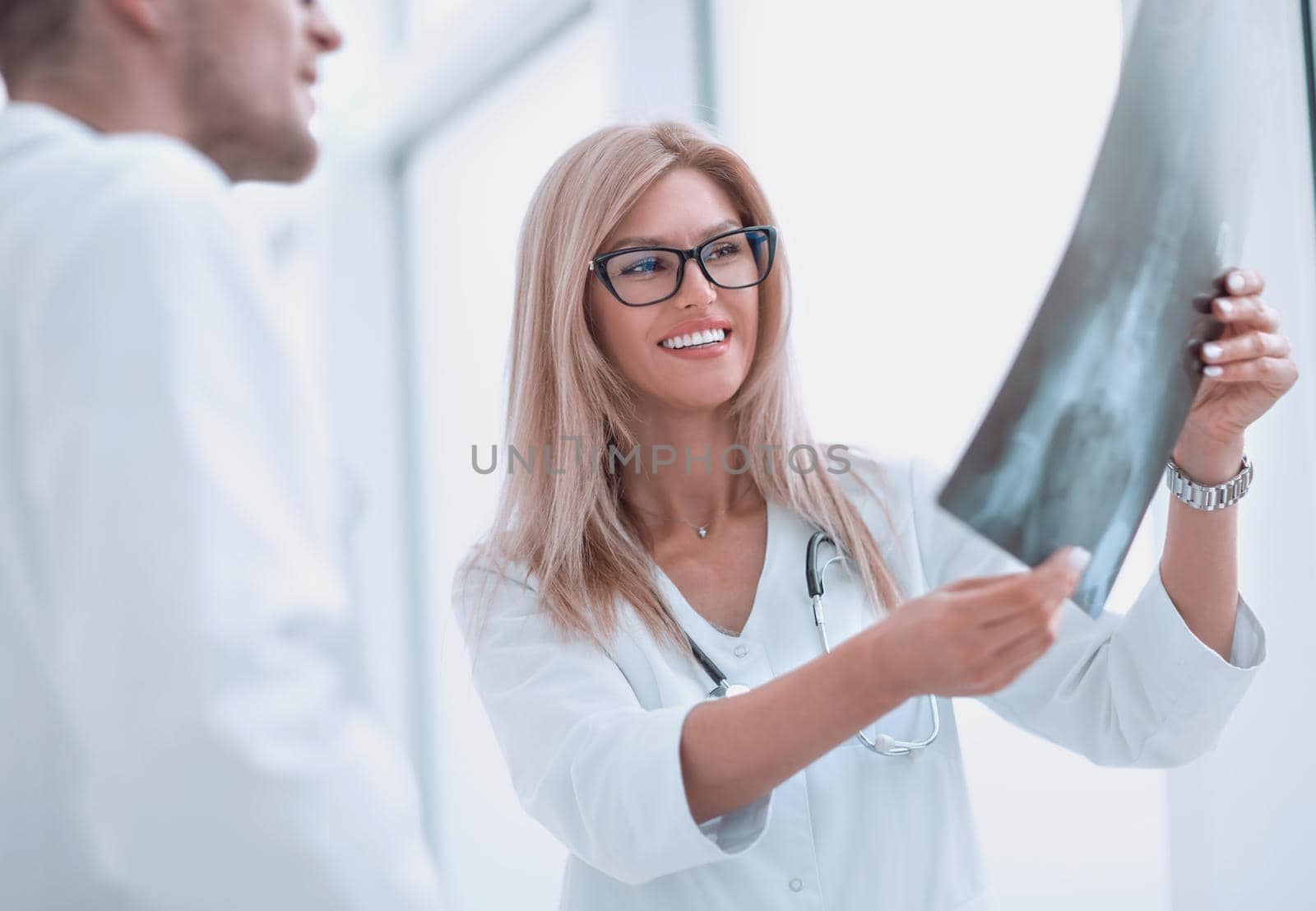 close up. happy doctors looking at patient's x-ray . the concept of health