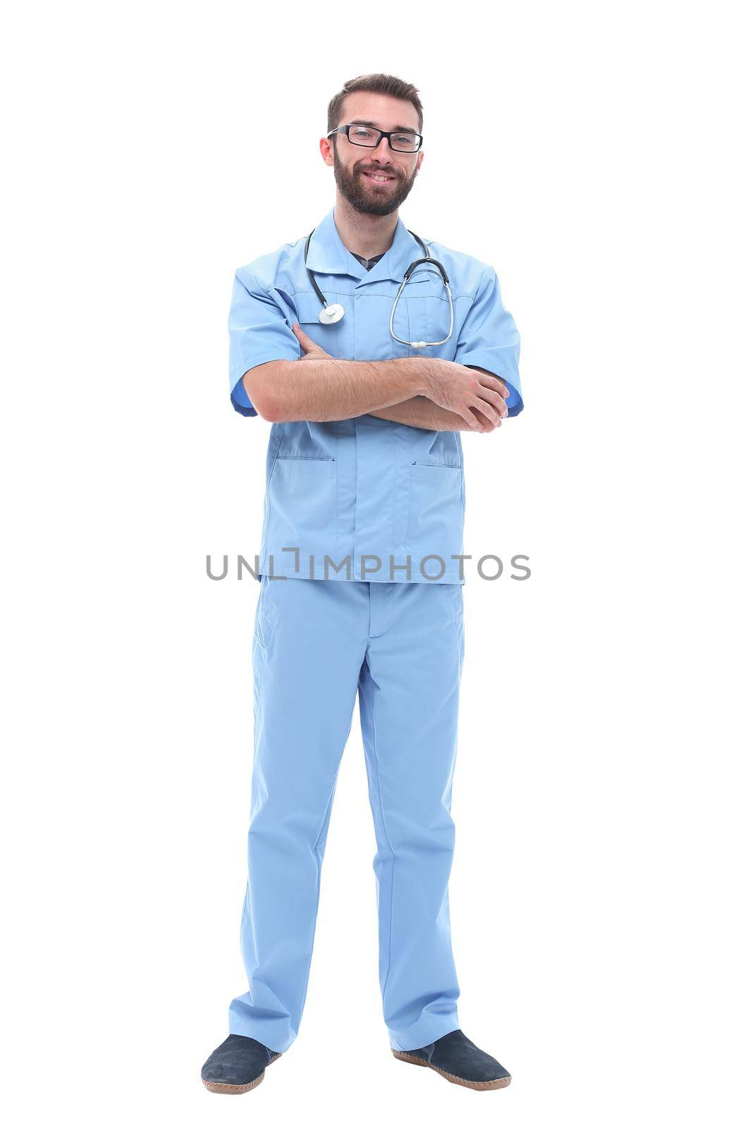 side view. smiling male doctor looking at camera . isolated on white background