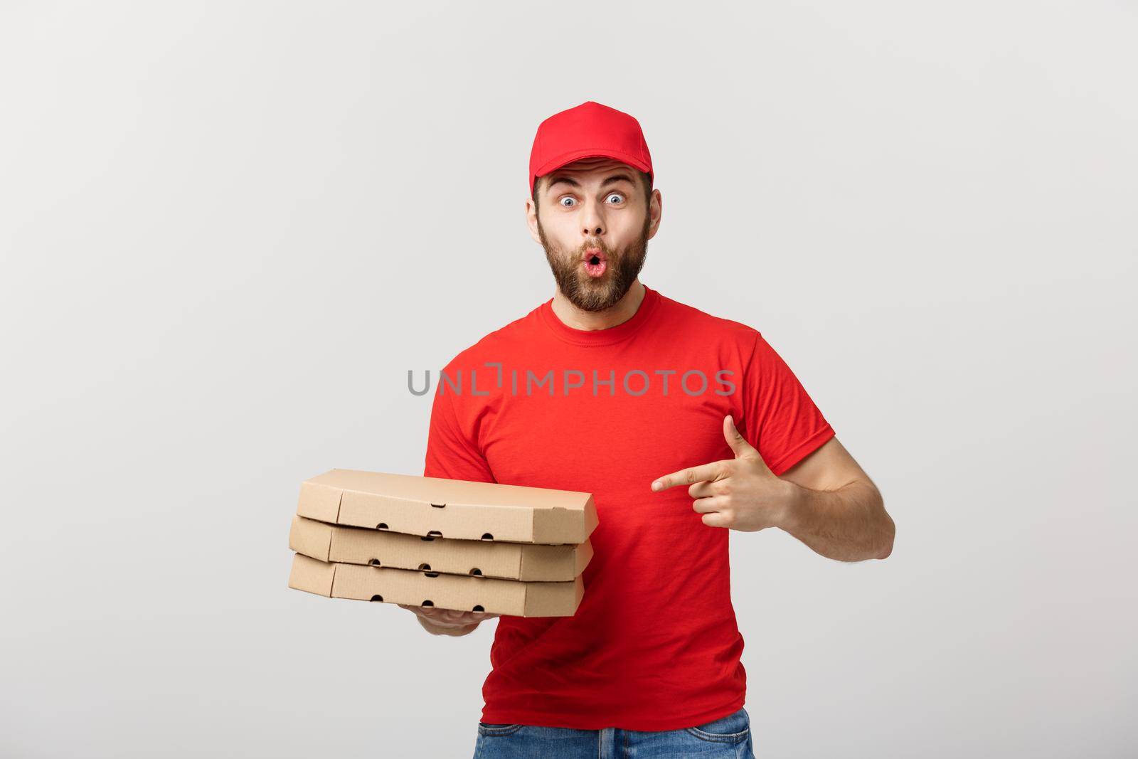 Delivery Concept: Portrait of Pizza delivery man presenting something in box. Isolated white background. by Benzoix