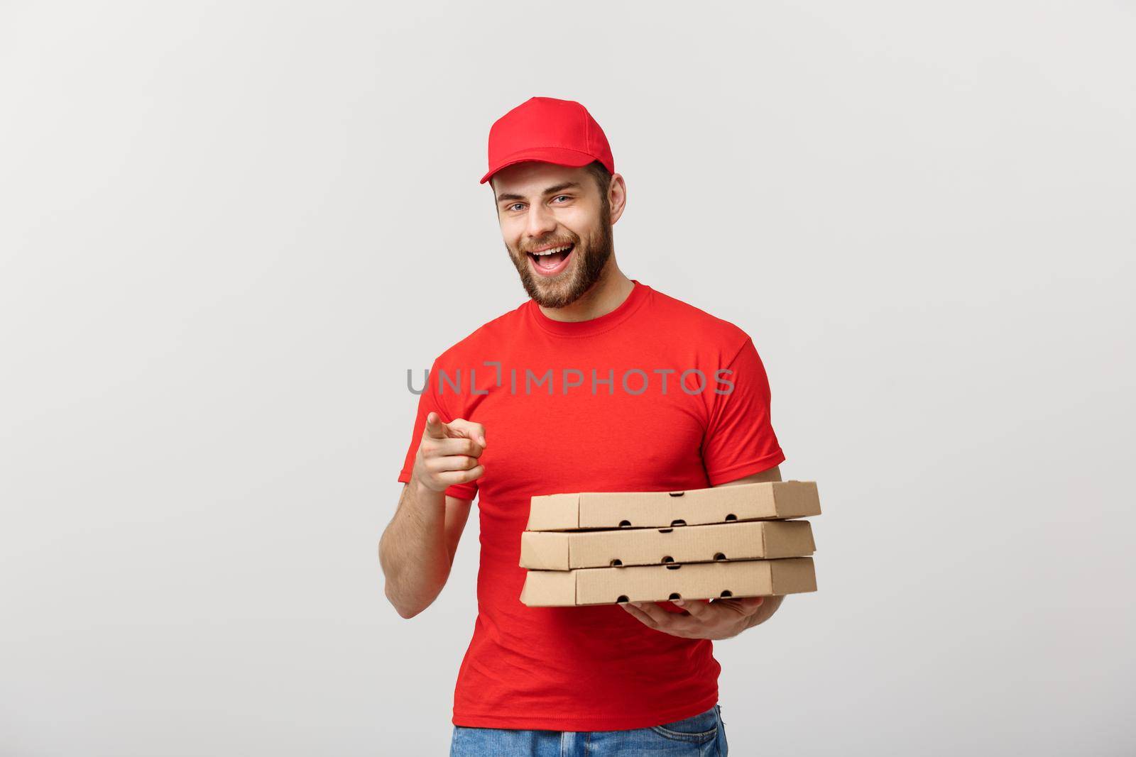 Delivery Concept: Portrait of Pizza delivery man presenting something in box. Isolated white background. by Benzoix