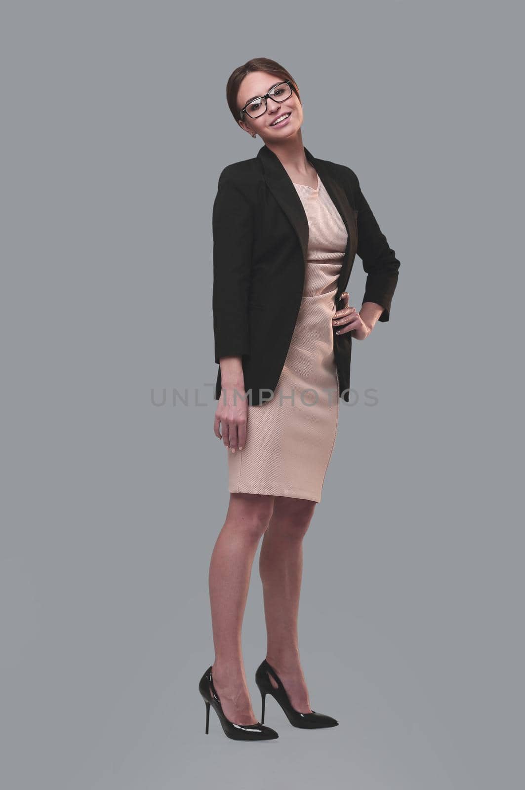 full length . portrait of a successful young business woman . isolated on white background