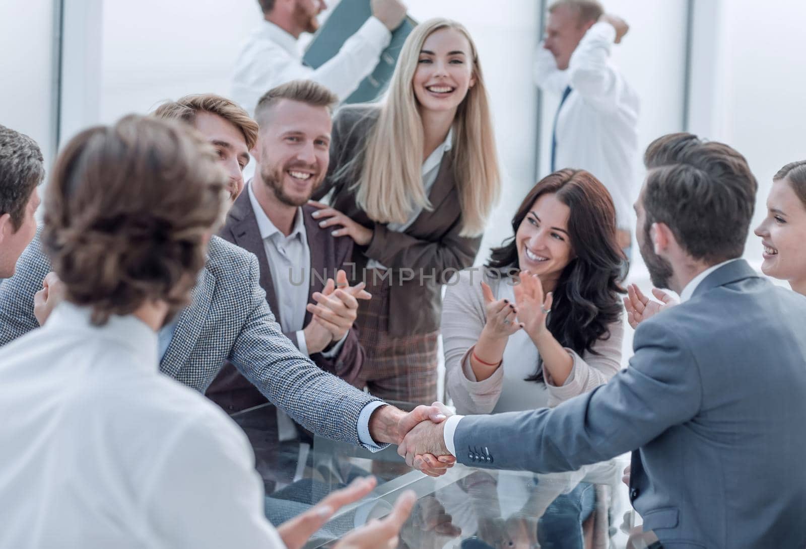 business group applauding business partners during the meeting. concept of cooperation