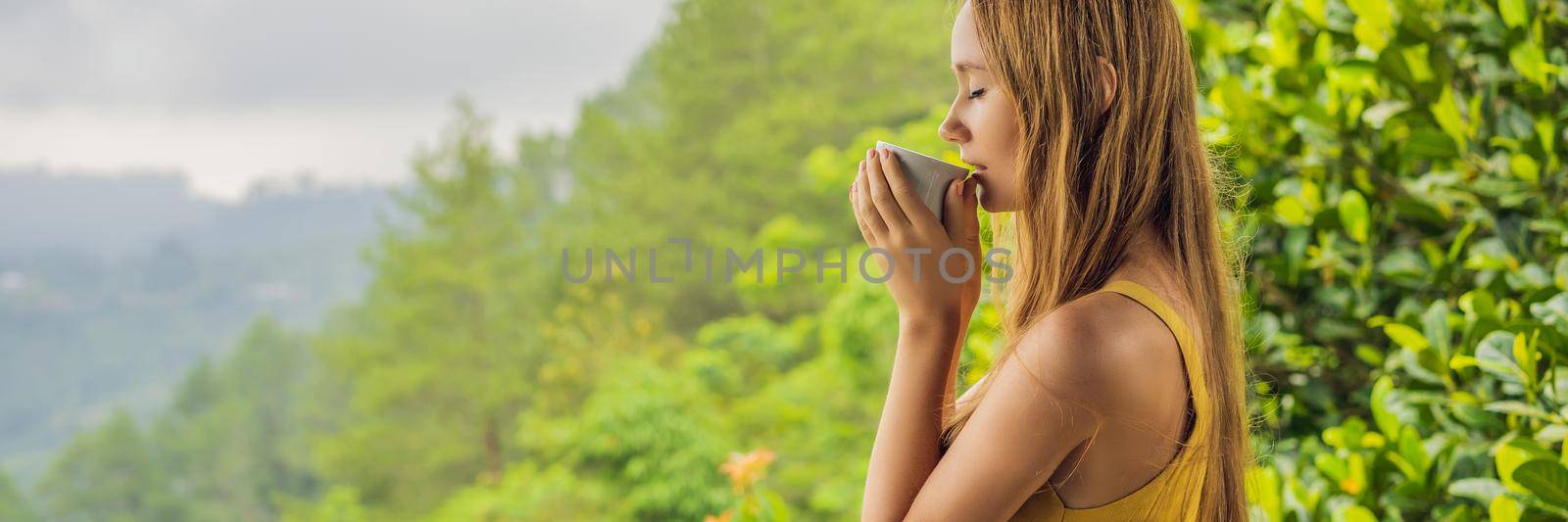 Young woman drinks coffee in a cafe in the mountains. BANNER, LONG FORMAT