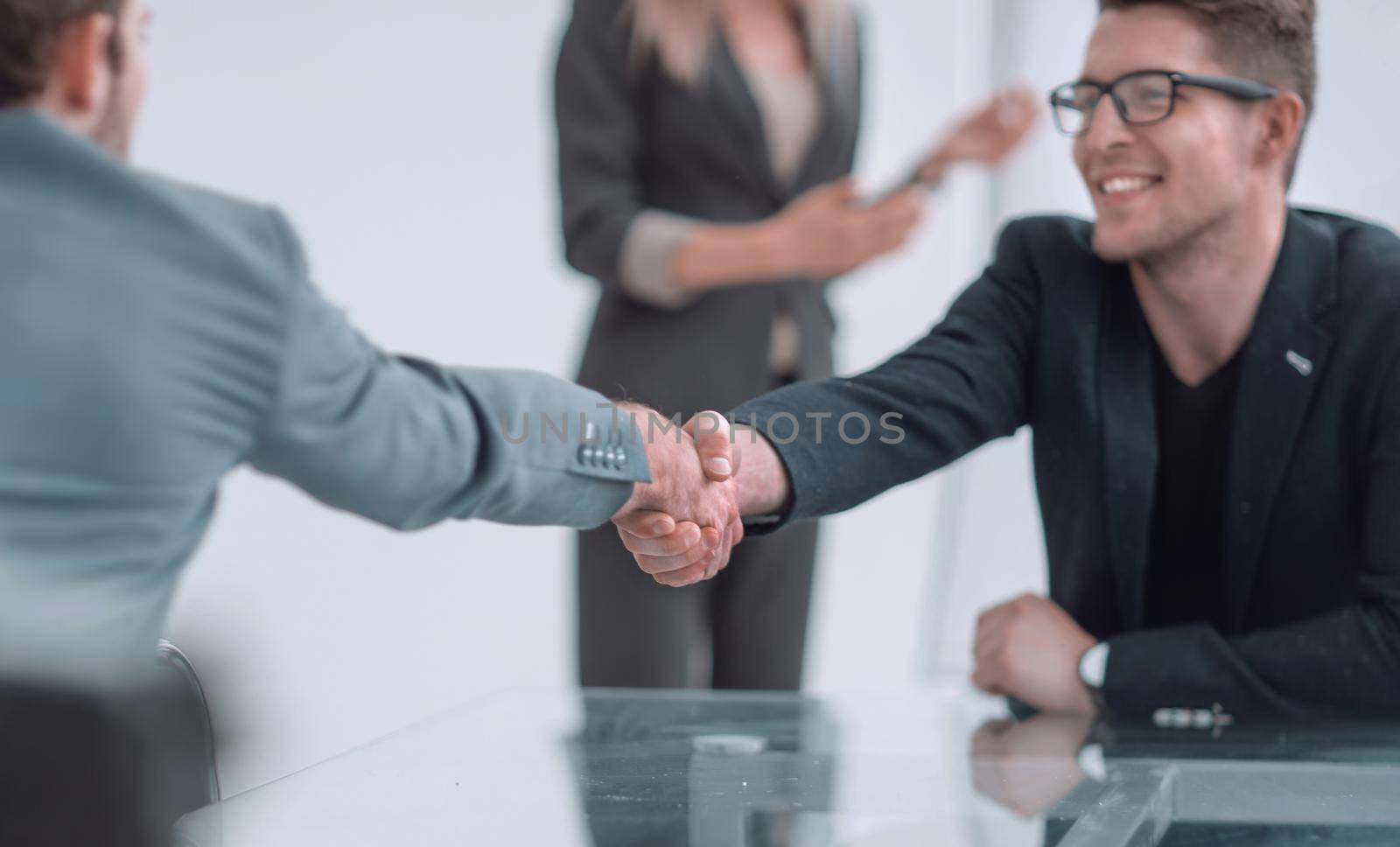 close up. business man shaking hands with his business partner. concept of cooperation