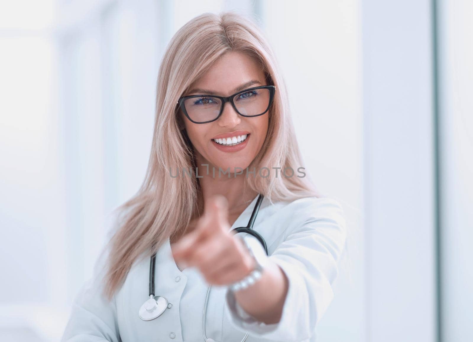 close up. confident woman doctor diagnosing pointing at you.