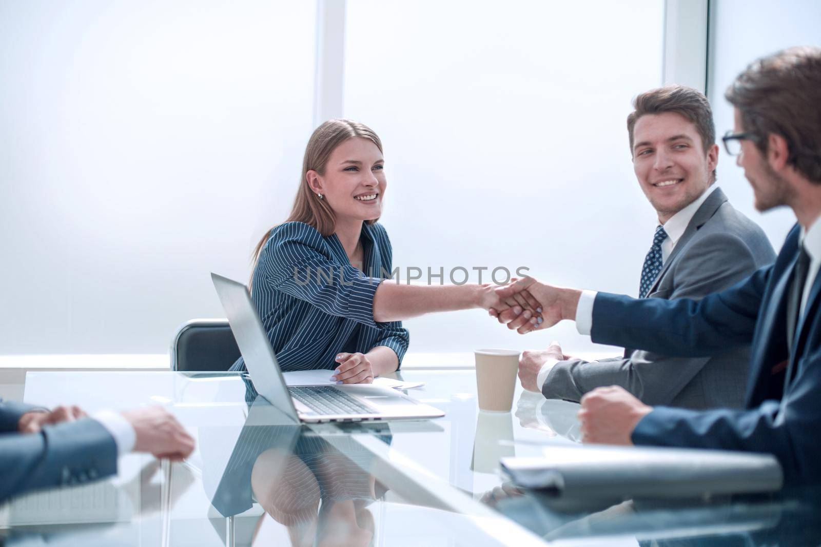Business people shaking hands in the boardroom. concept of partnership