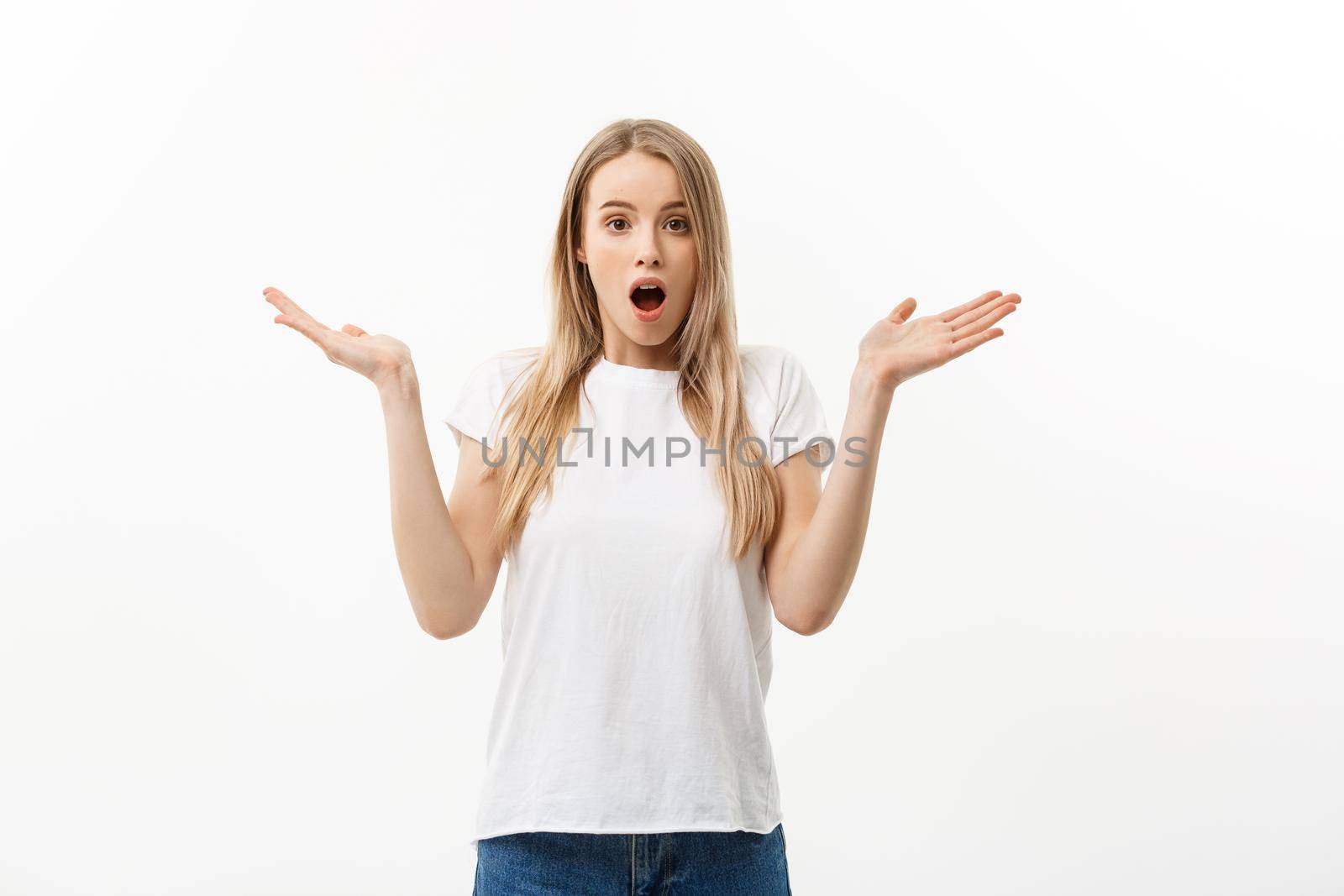 Lifestyle Concept: Portrait of a scared frightened girl standing and surprising facial expression isolated over white background