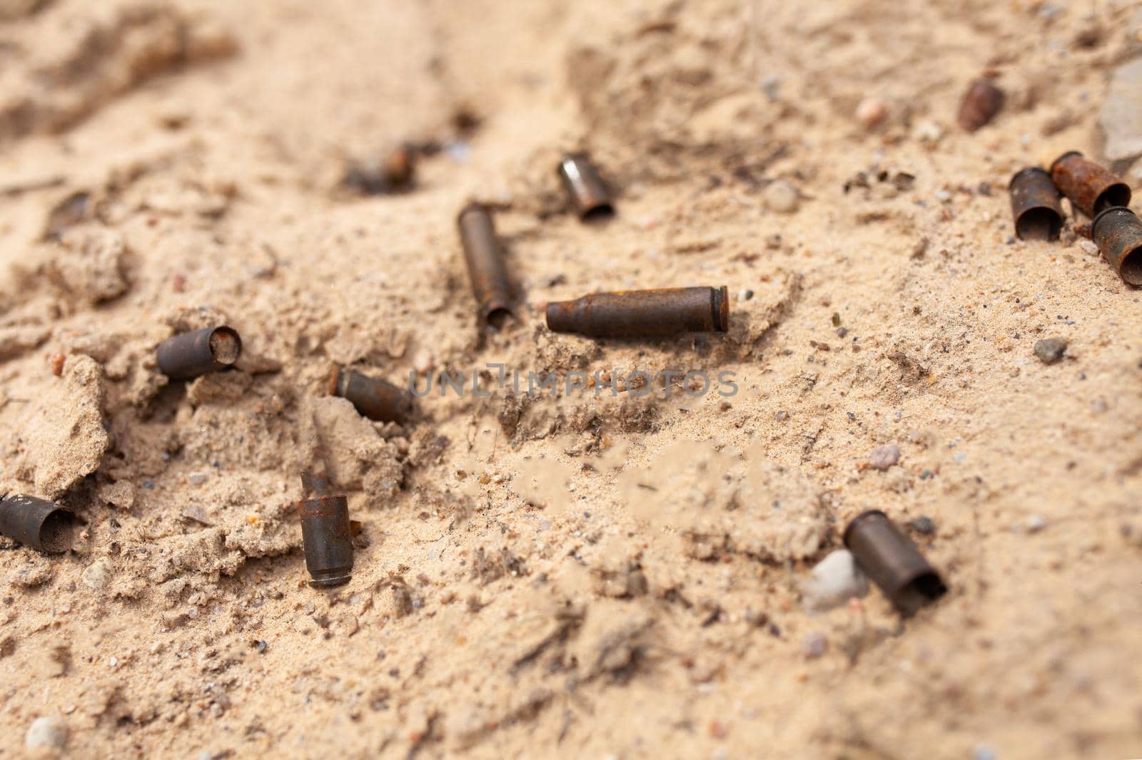 cartridge cases on the sand. rifle and pistol cartridges