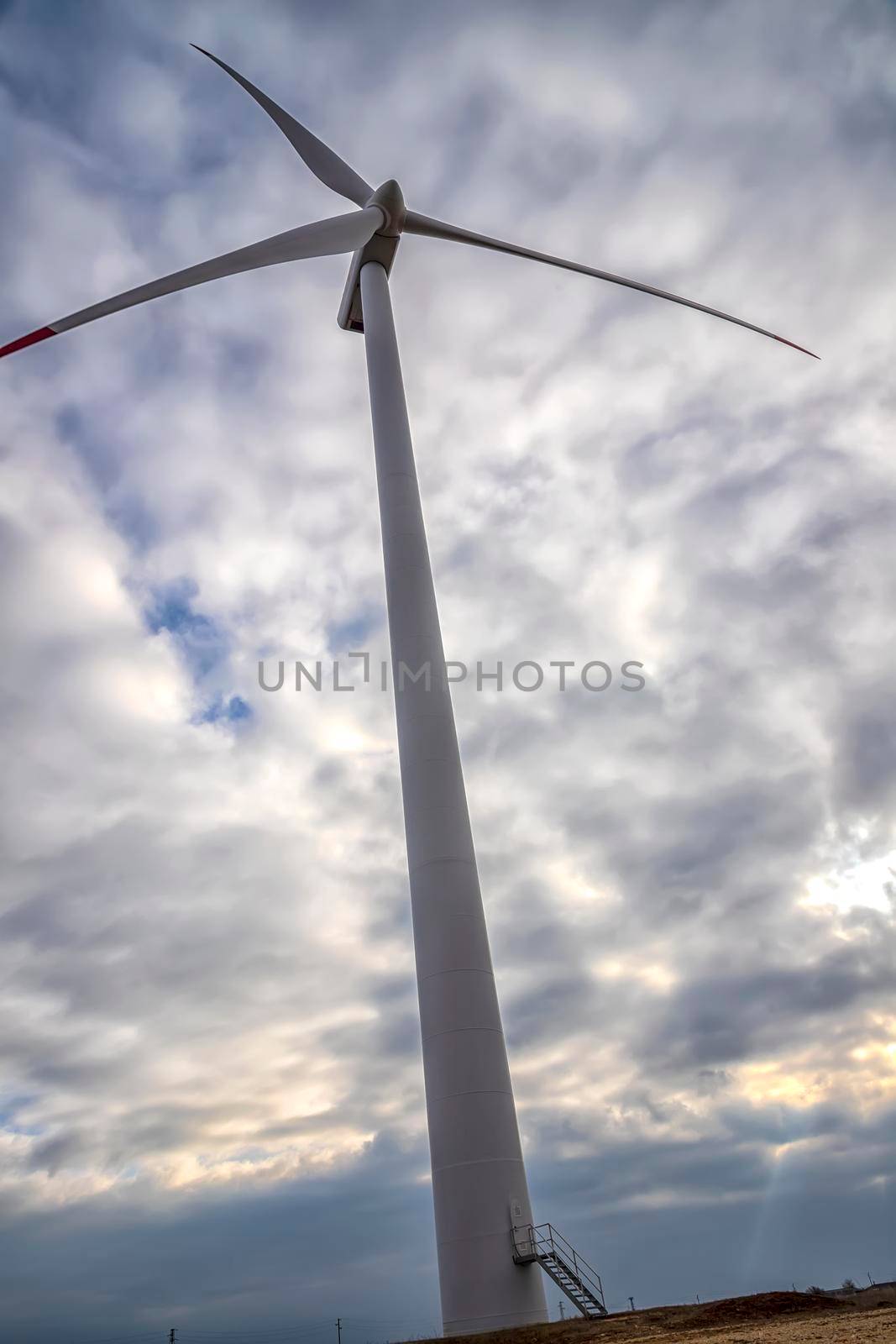 A wind turbine. The windmill for electric power production. Green energy. 