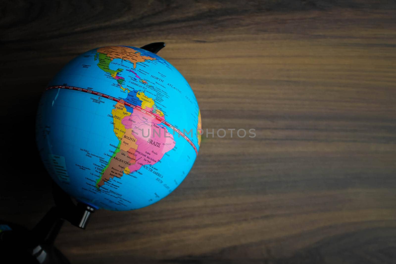Travel on world globe map. Sign, symbol of traveling on wooden table. Space for text
