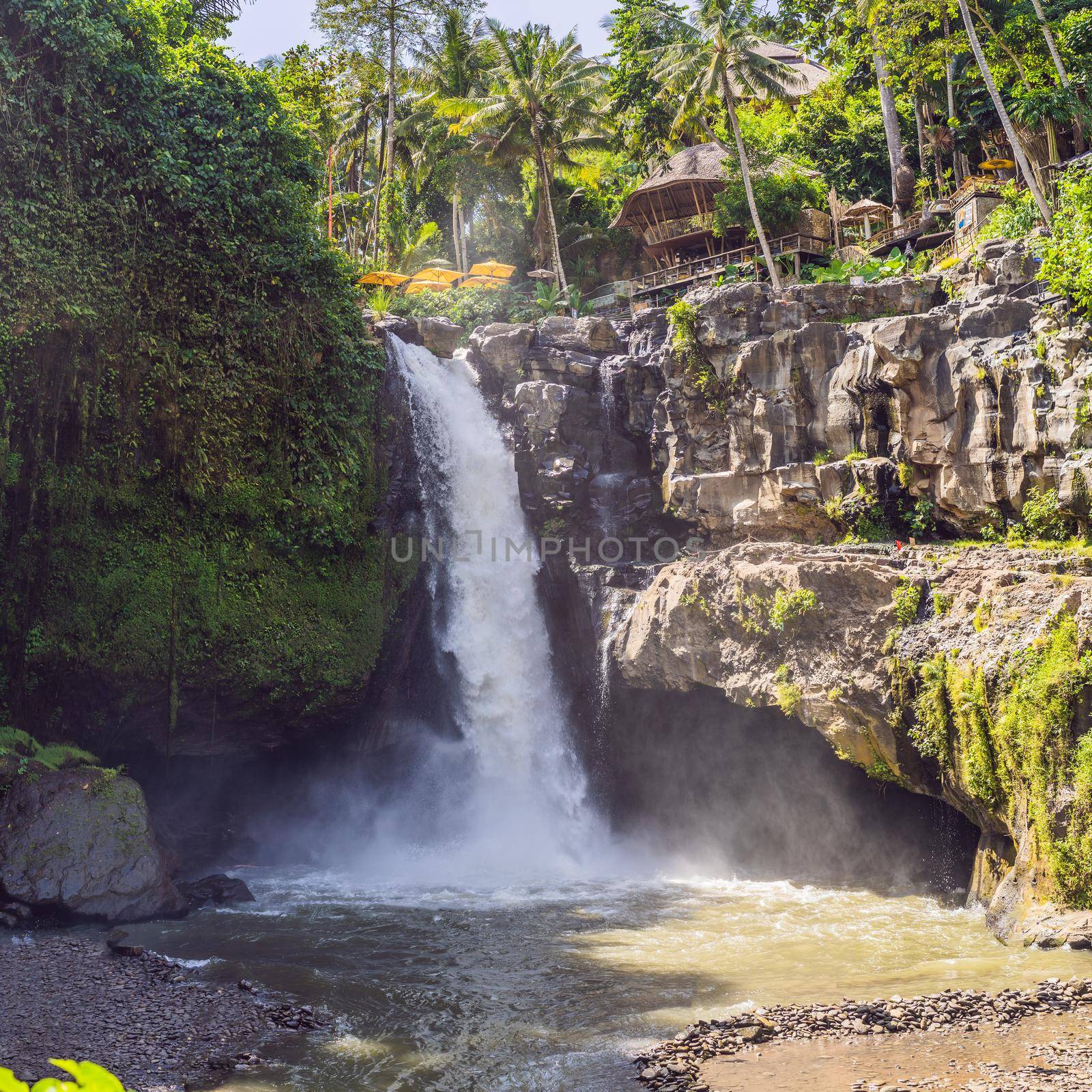 Tegenungan Waterfall near Ubud, Bali, Indonesia. Tegenungan Waterfall is a popular destination for tourists visiting Bali, Indonesia by galitskaya