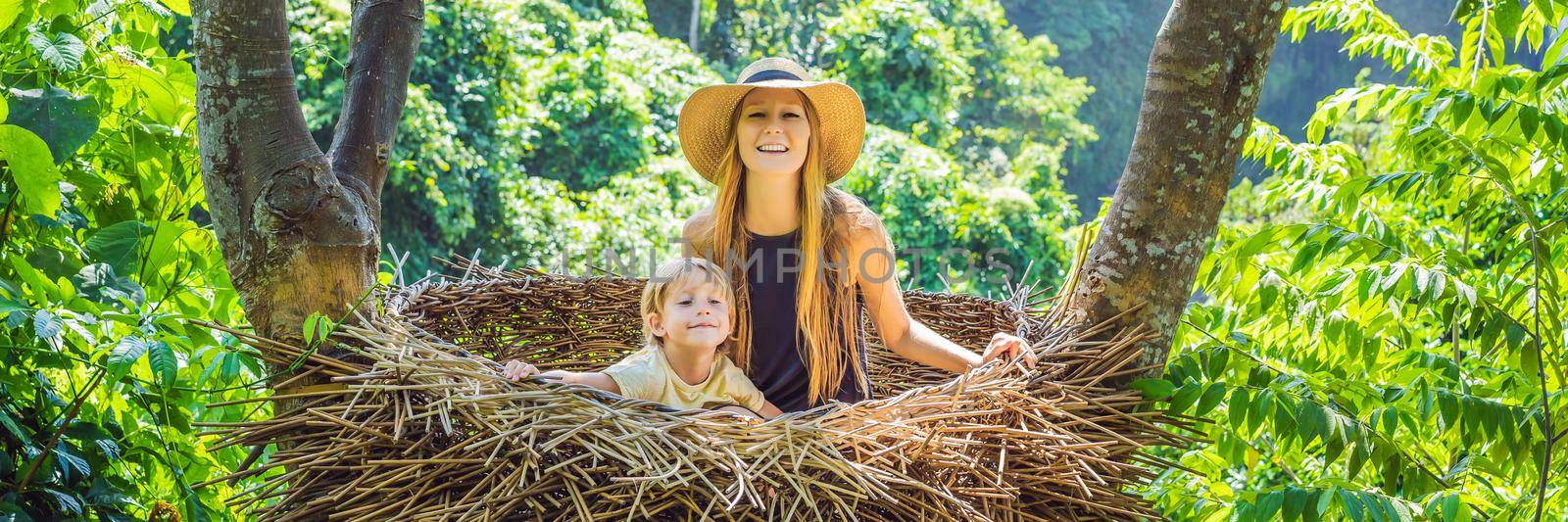 BANNER, LONG FORMAT Bali trend, straw nests everywhere. Young tourist enjoying her travel around Bali island, Indonesia. Making a stop on a beautiful hill. Photo in a straw nest, natural environment. Lifestyle by galitskaya