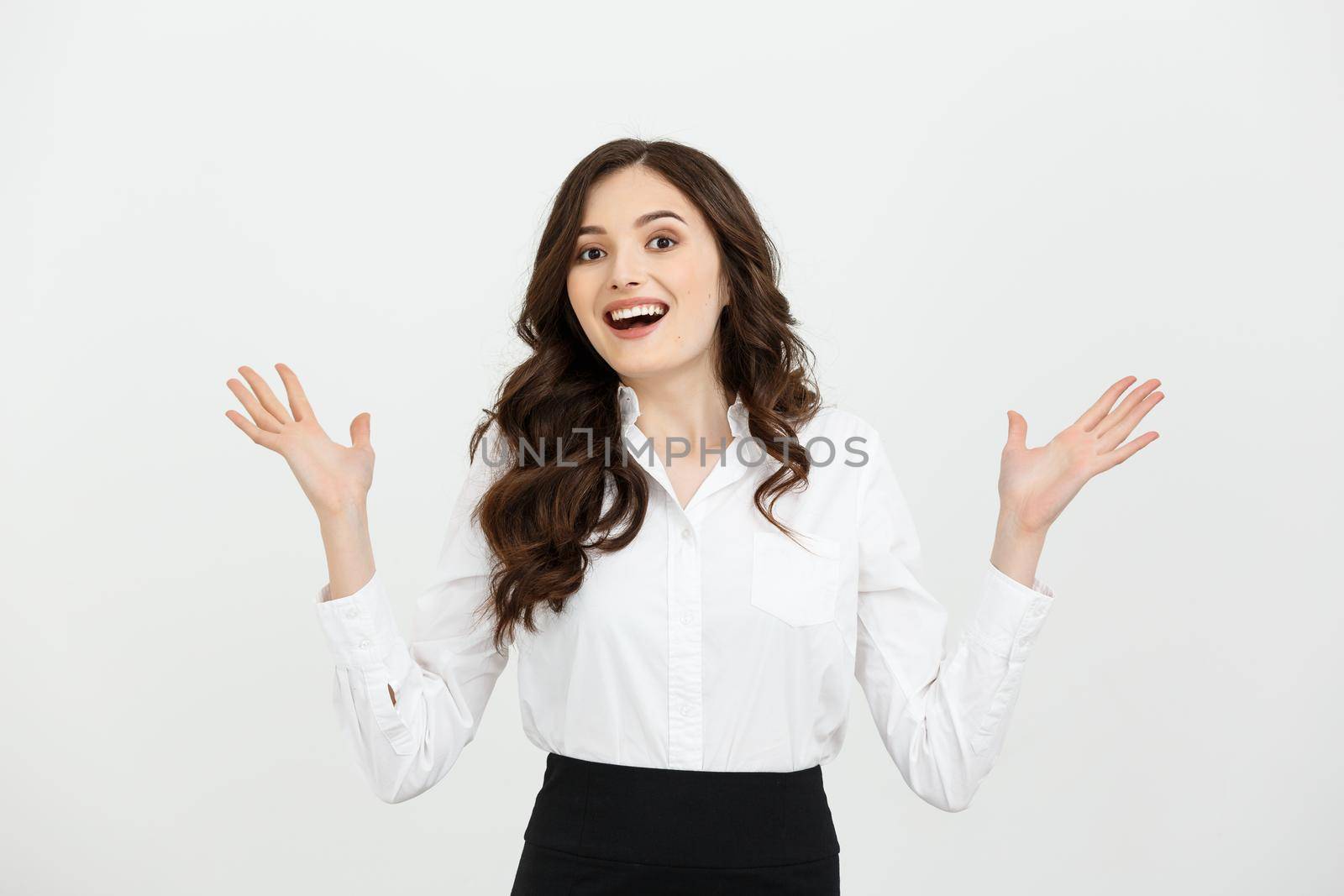 Business woman happy and surprise showing product .Beautiful girl holding hand to the side.