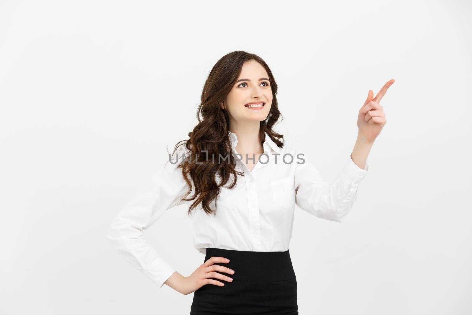 Business Concept Portrait of smiling business woman pointing finger on copy space. iswolated portrait