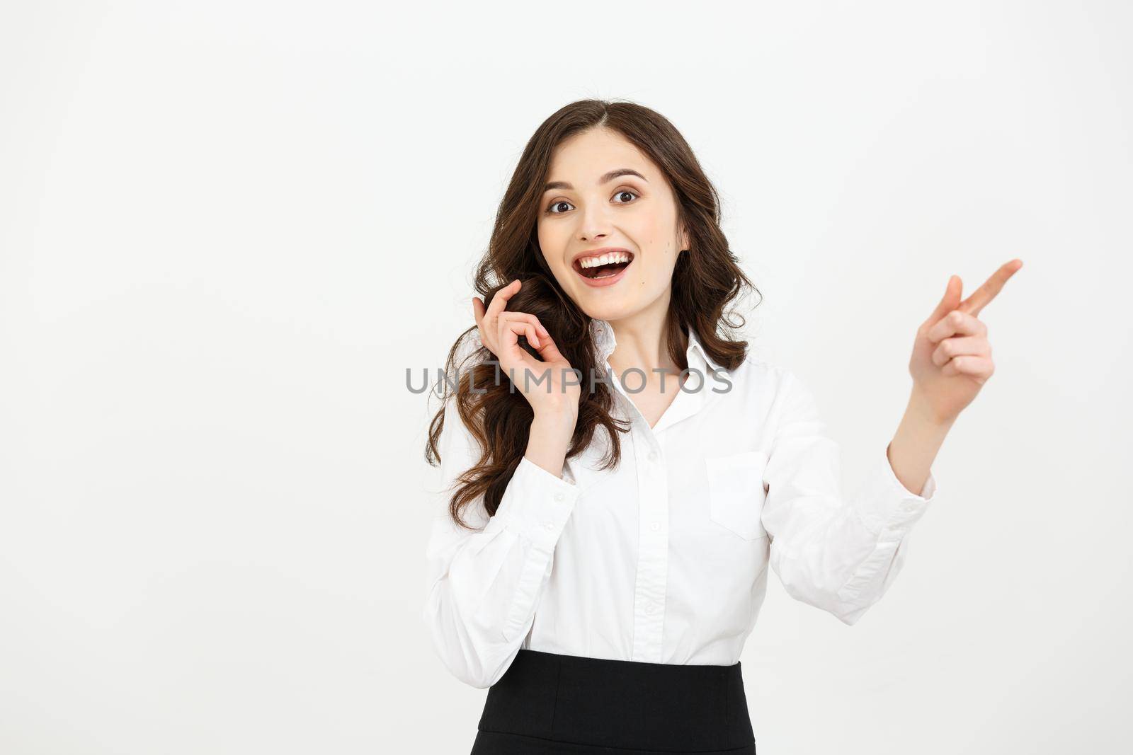 Business Concept Portrait of smiling business woman pointing finger on copy space. iswolated portrait