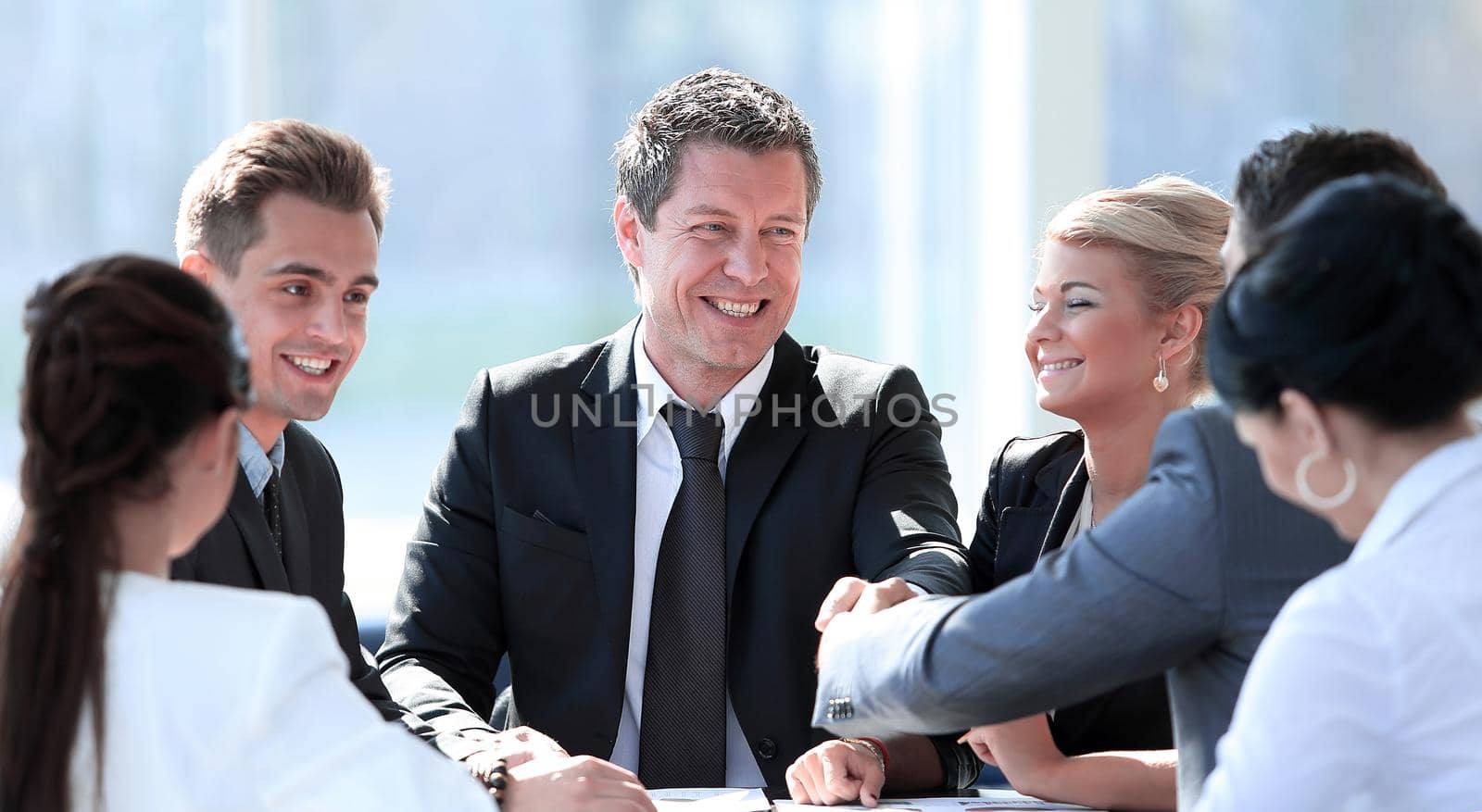 two business partners shaking hands on meeting.photo with copy space