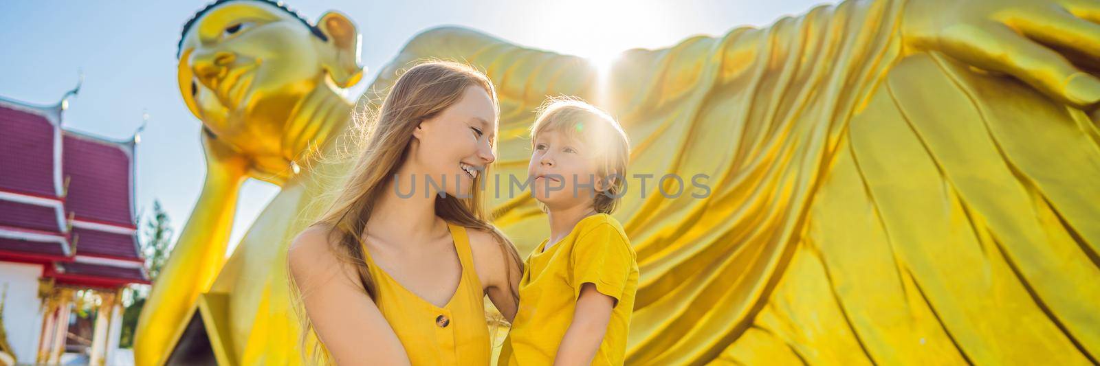 Happy tourists mother and son on background ofLying Buddha statue BANNER, LONG FORMAT by galitskaya