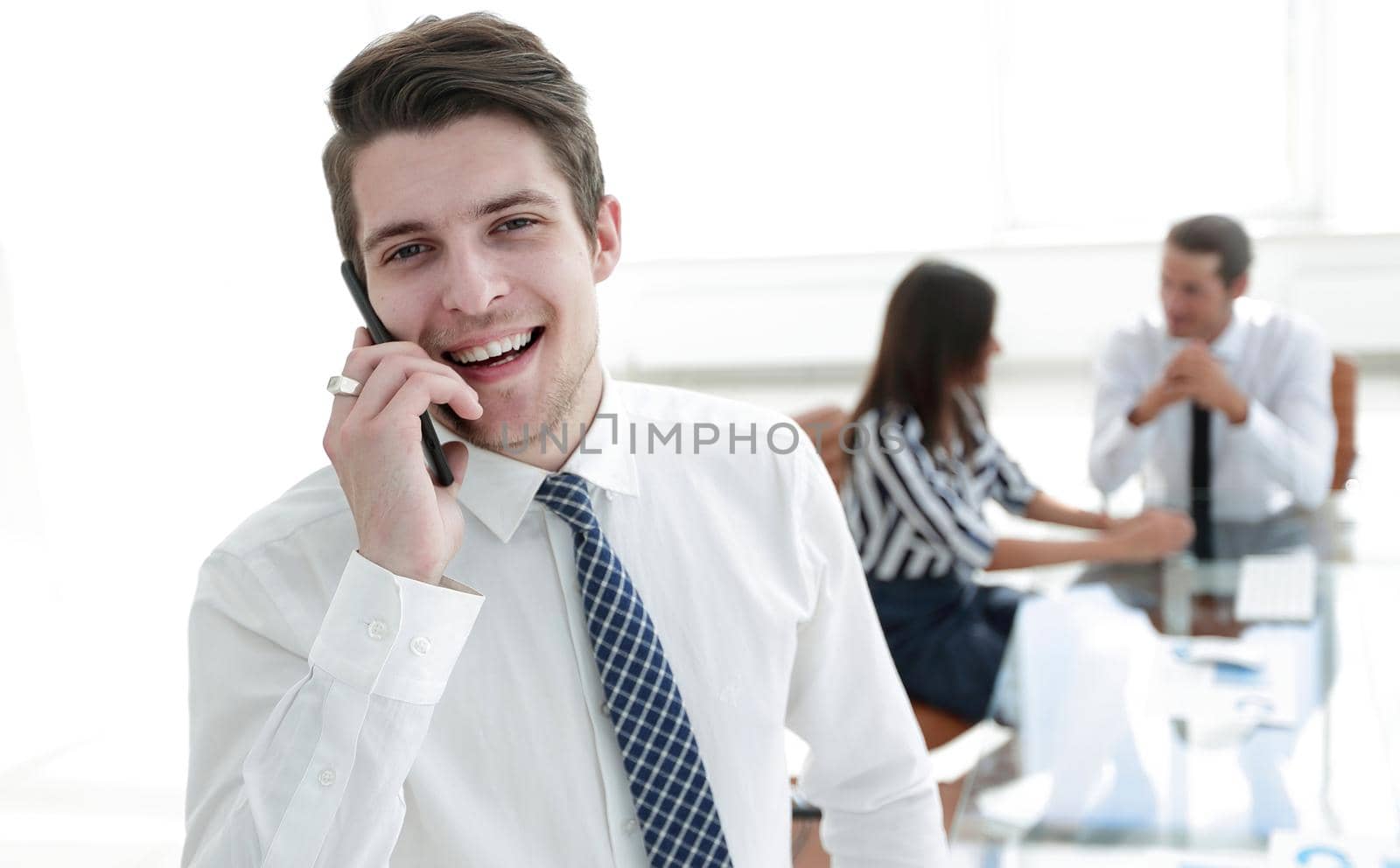 closeup.businessman talking on a mobile phone.photo with copy space