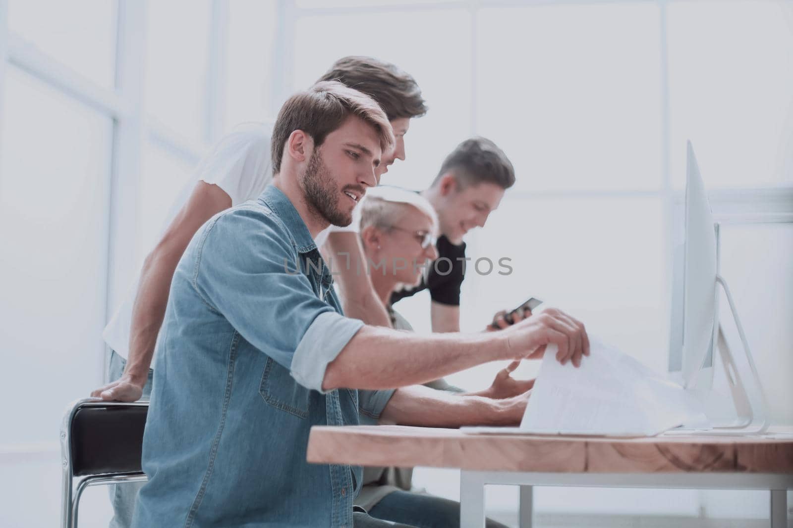 close up. a group of people working on computers. people and technology