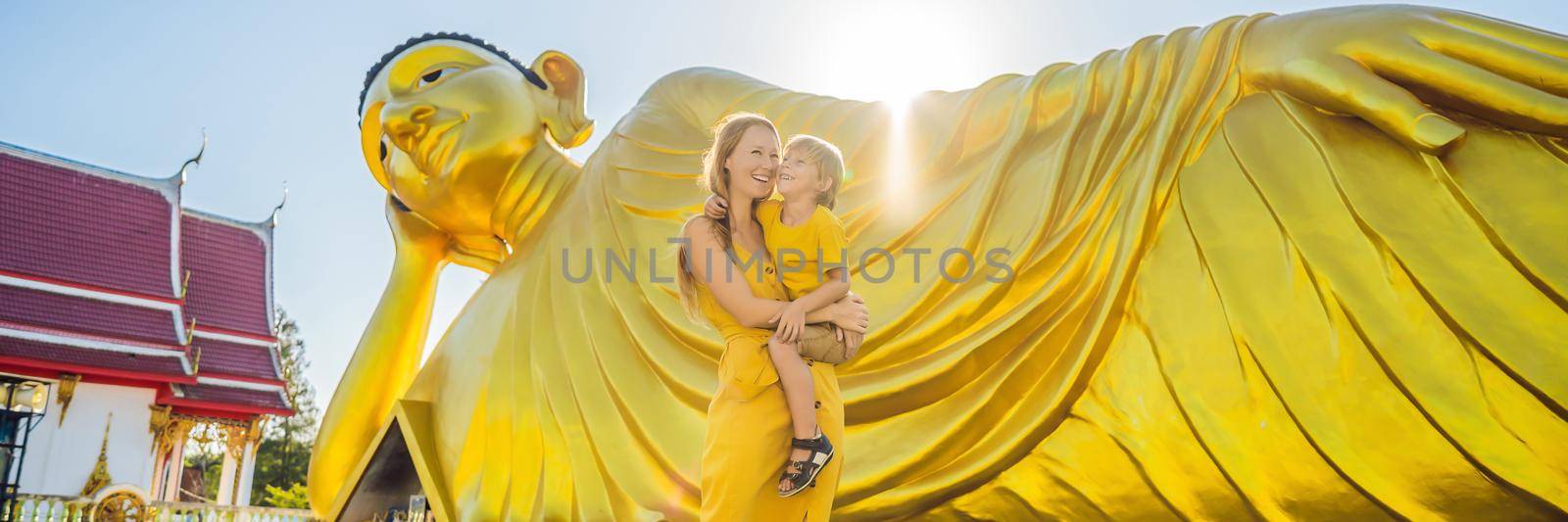 Happy tourists mother and son on background ofLying Buddha statue. BANNER, LONG FORMAT