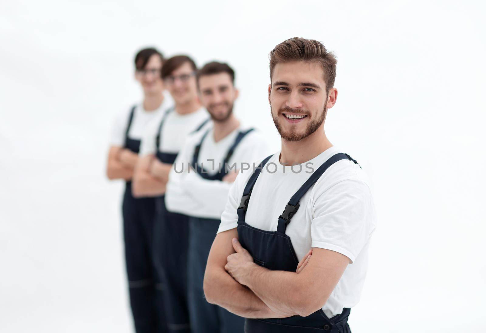 Cheerful team of responsible movers isolated on white background by asdf