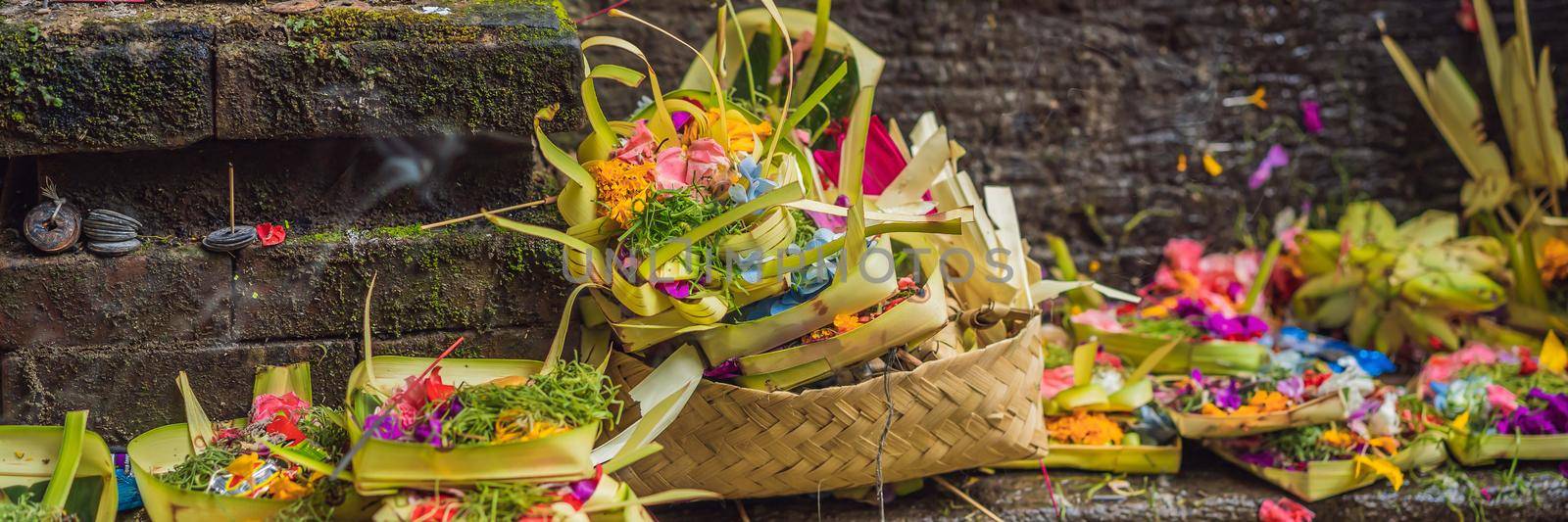 Daily offerings - canang sari is very important in Bali, Indonesia BANNER, LONG FORMAT by galitskaya