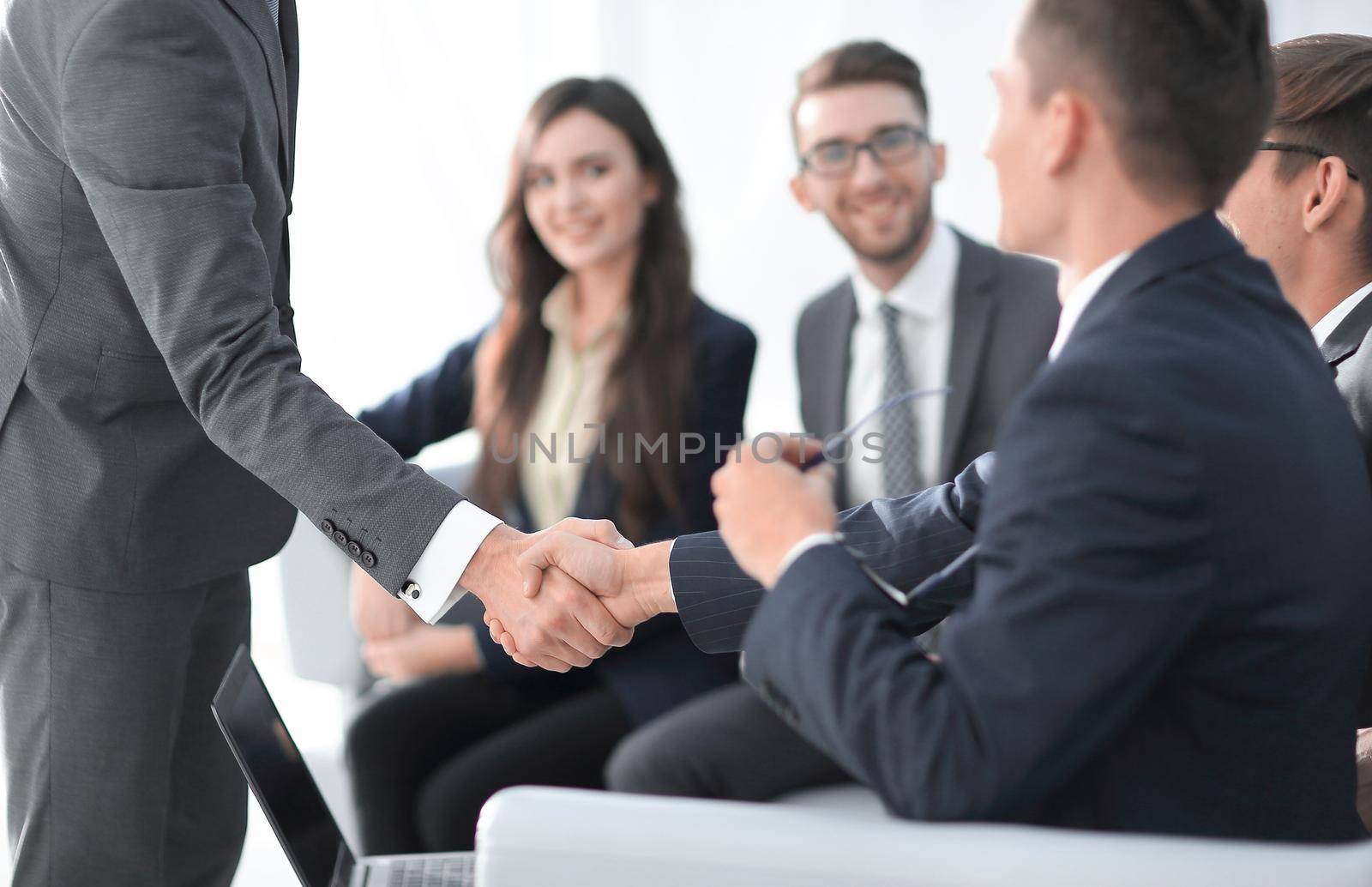 Handshake of businessmen greeting each other.