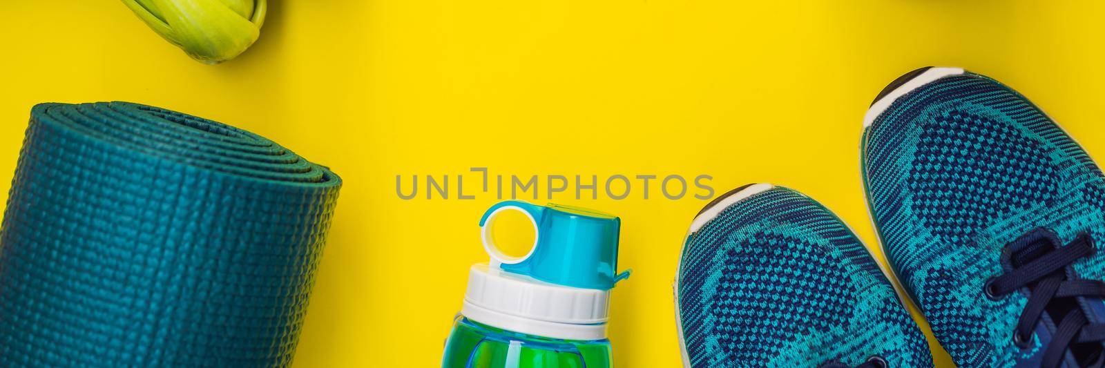 BANNER, LONG FORMAT Everything for sports turquoise, blue shades on a yellow background and spinach smoothies. Yoga mat, sport shoes sportswear and bottle of water. Concept healthy lifestyle, sport and diet. Sport equipment. Copy space by galitskaya