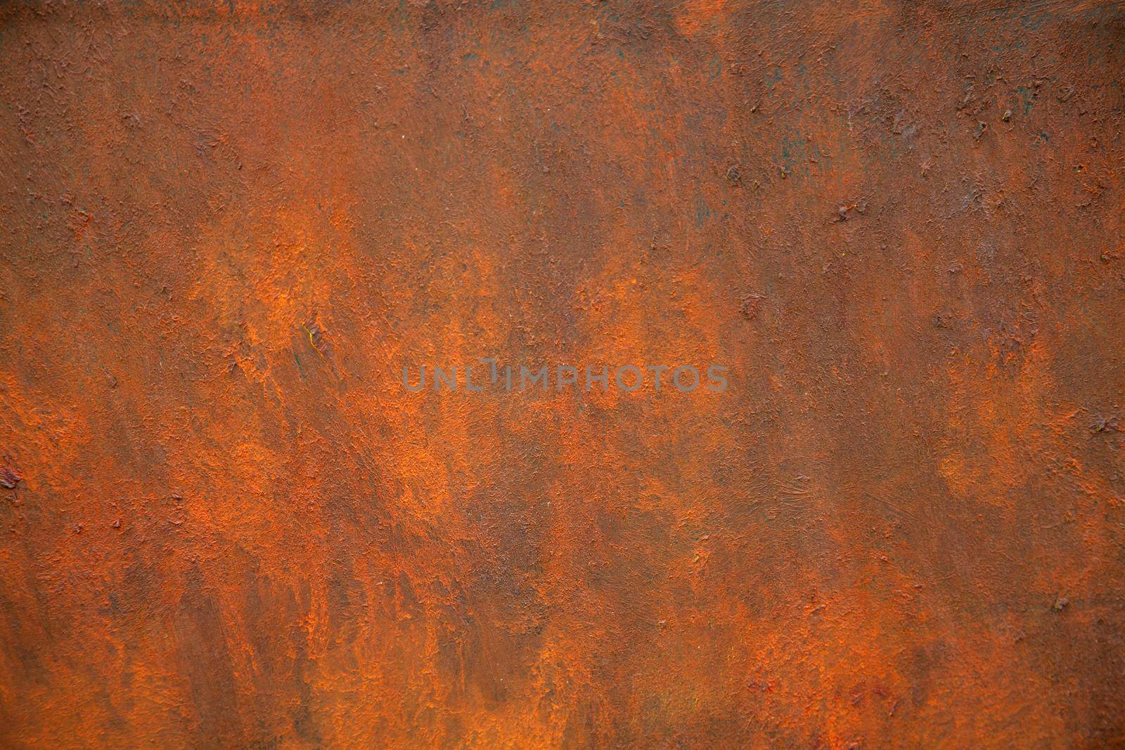The texture of rusty metal is brown and orange