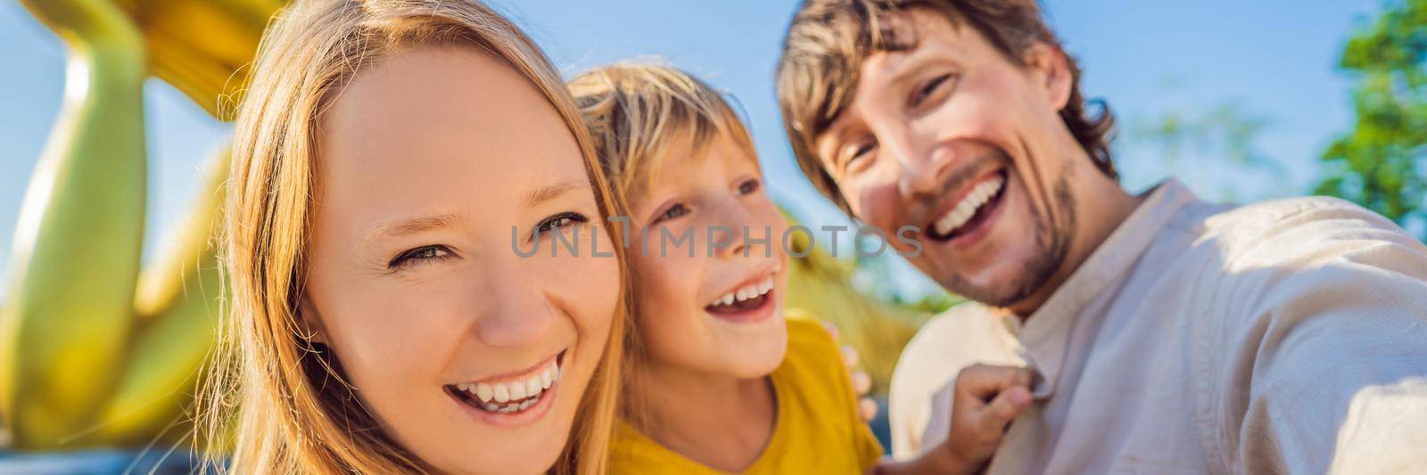 Happy tourists mother, father and son on background ofLying Buddha statue. BANNER, LONG FORMAT
