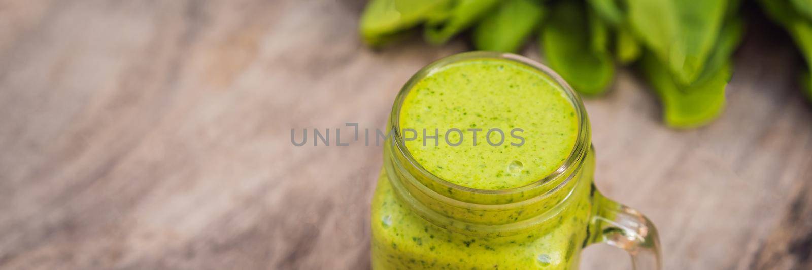 Ginger green apple smoothie on concrete background. It can be used as a background. BANNER, LONG FORMAT