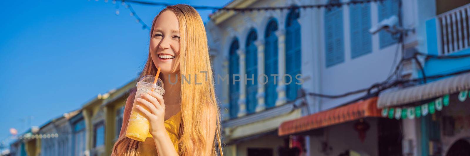 Woman tourist on the Street in the Portugese style Romani in Phuket Town. Also called Chinatown or the old town. BANNER, LONG FORMAT