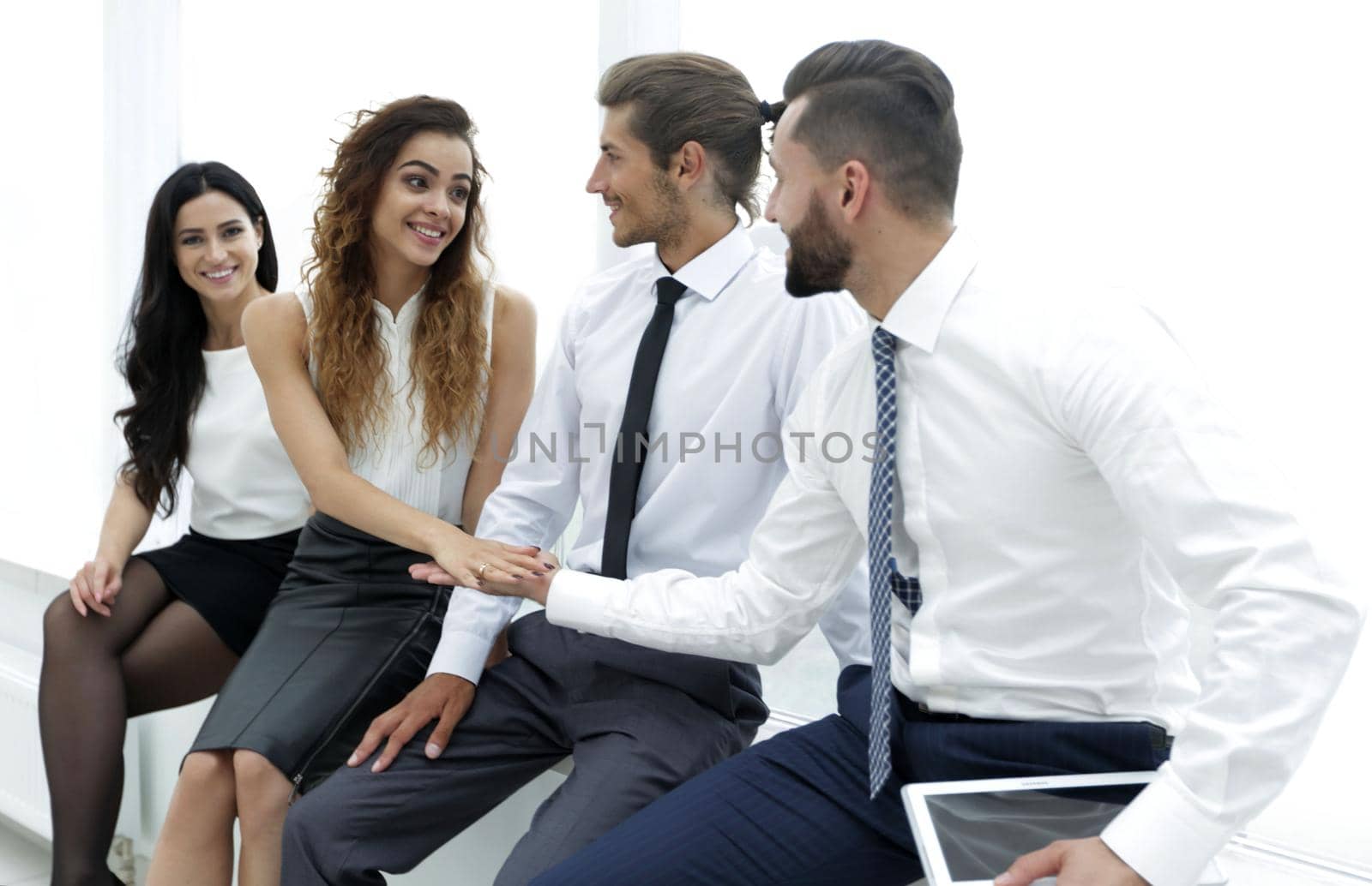 colleagues giving each other high five.isolated on white