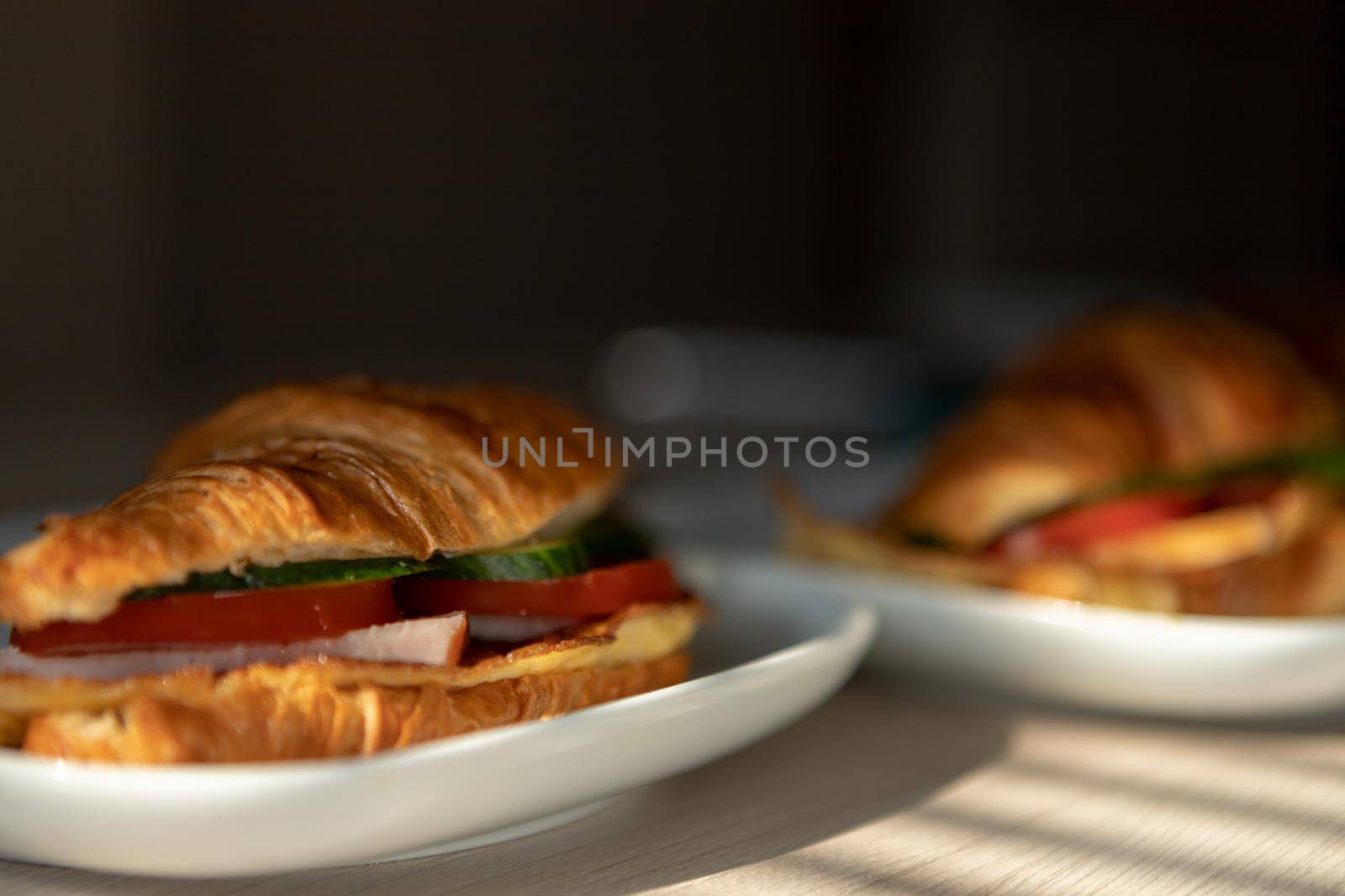 fresh croissants stuffed with omelet carbonade for breakfast by bySergPo
