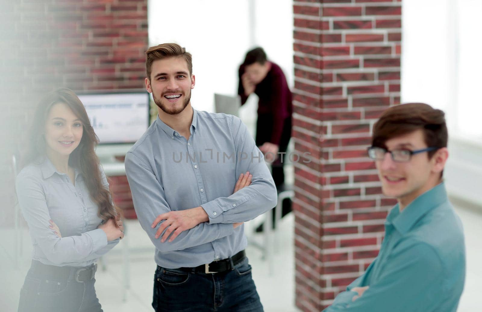 Business colleagues discussing at creative office.