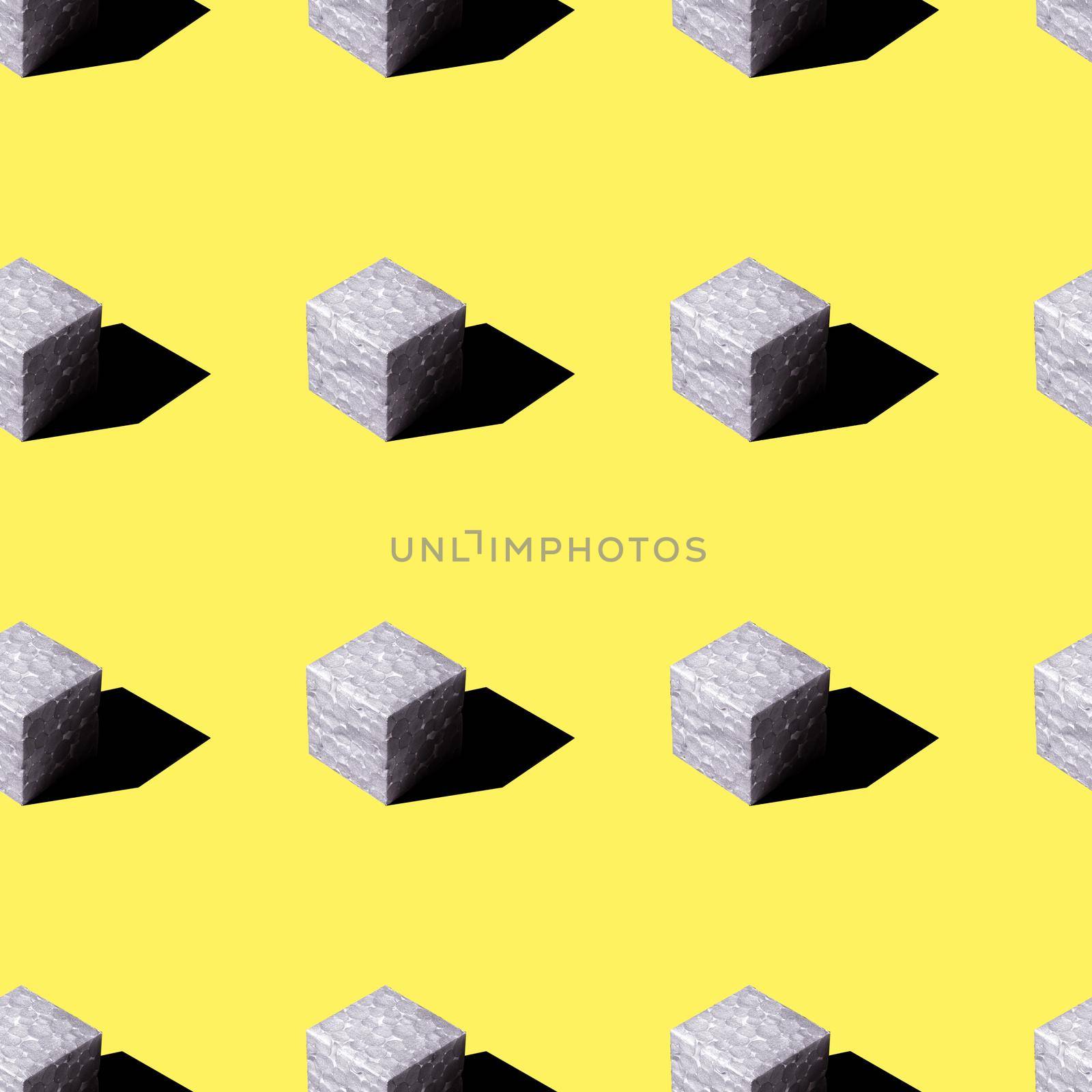 Gray squares with a black shadow on a yellow background are highlighted with a hard light. seamless pattern.