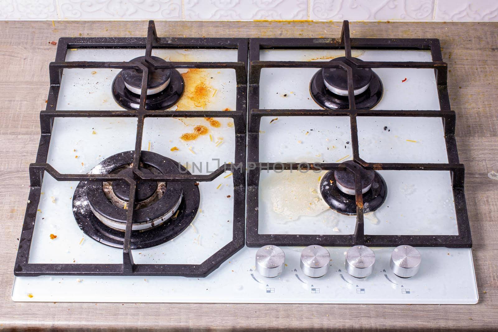 Dirty gas hob, soiled in cooking, stove in grease. Unsanitary conditions, disorder in the house.