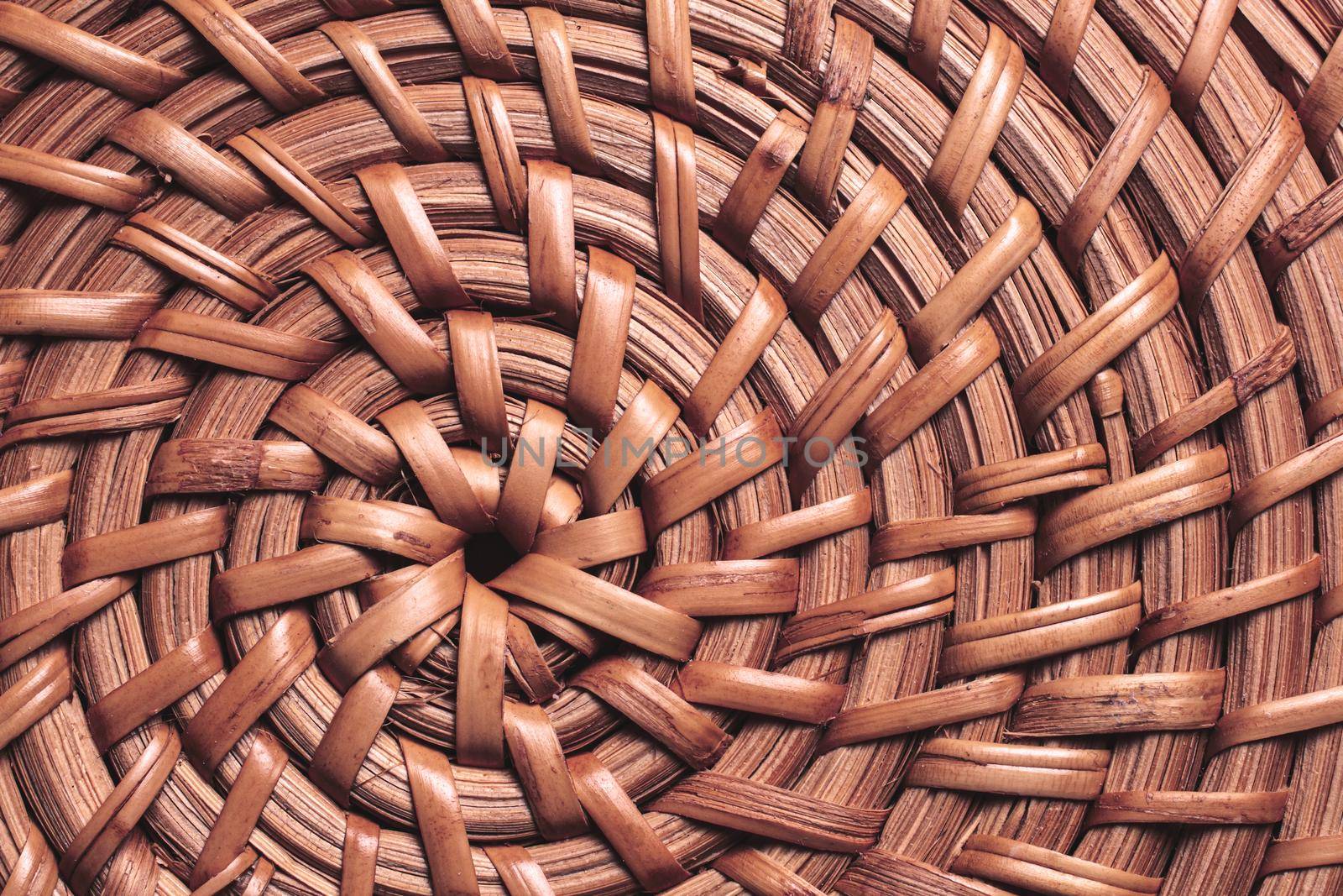 wicker circular basket pattern close-up. handmade