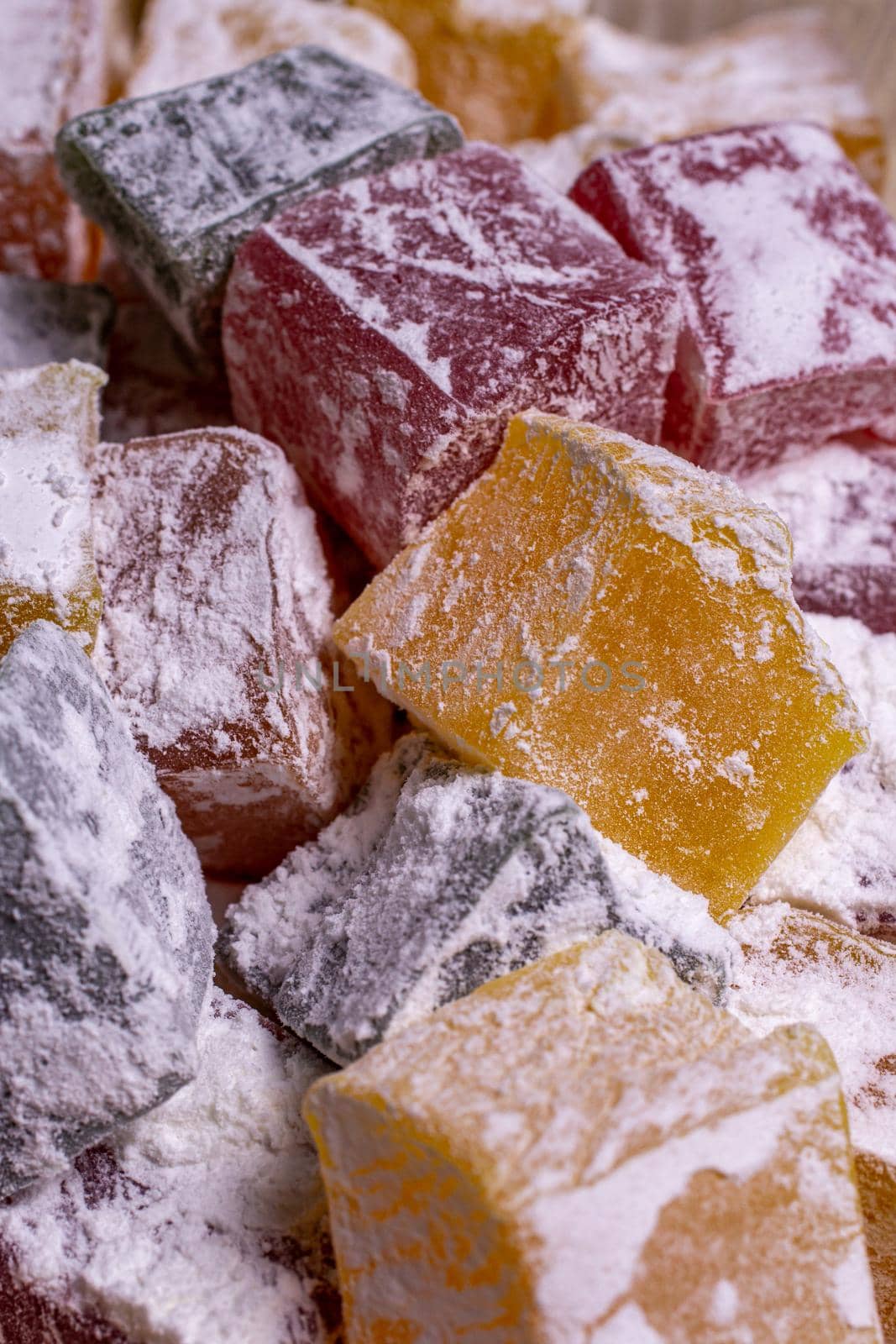 multicolored turkish delight in powdered sugar close-up by bySergPo