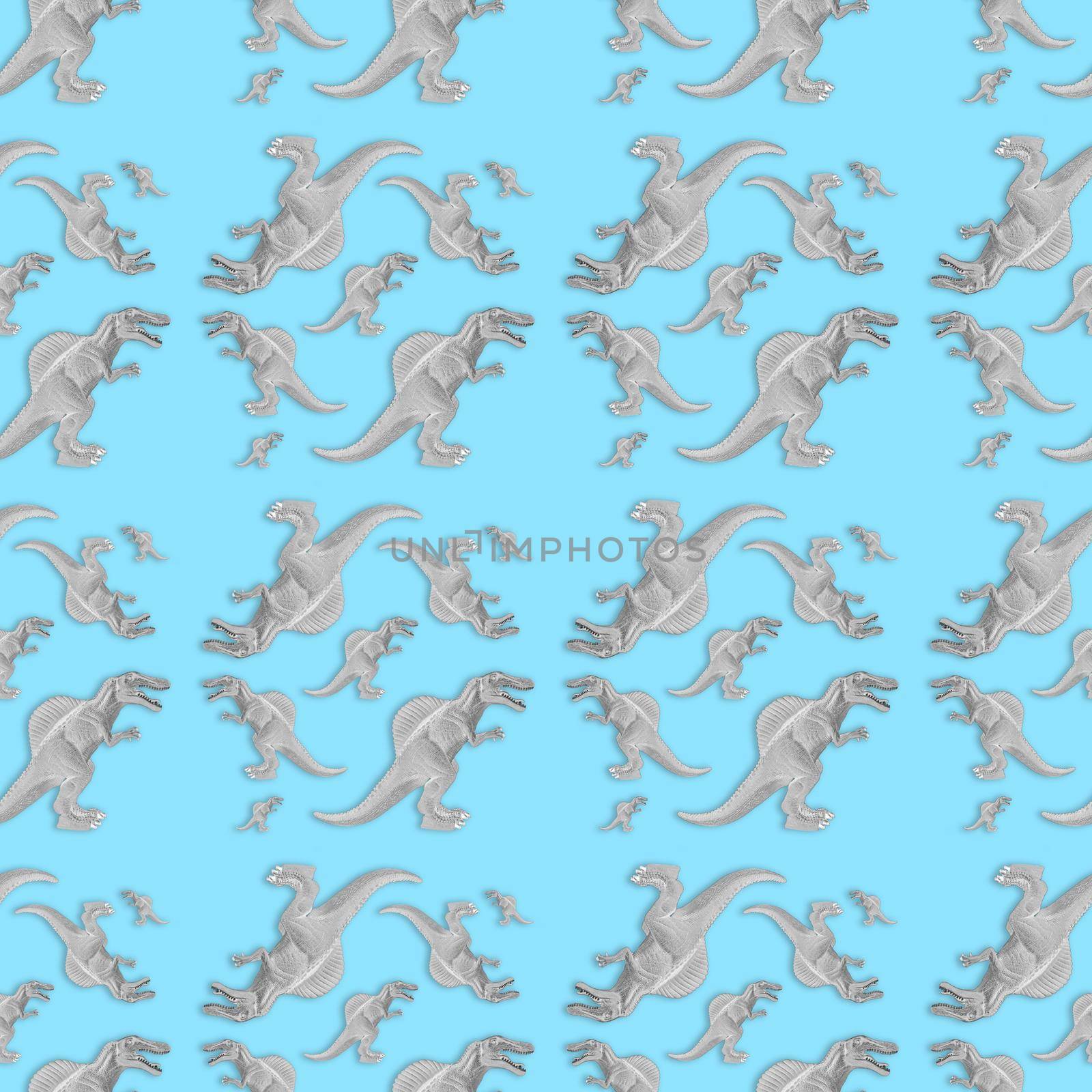 Creative seamless dinosaur pattern on blue background. Abstract art. The concept of minimalism.