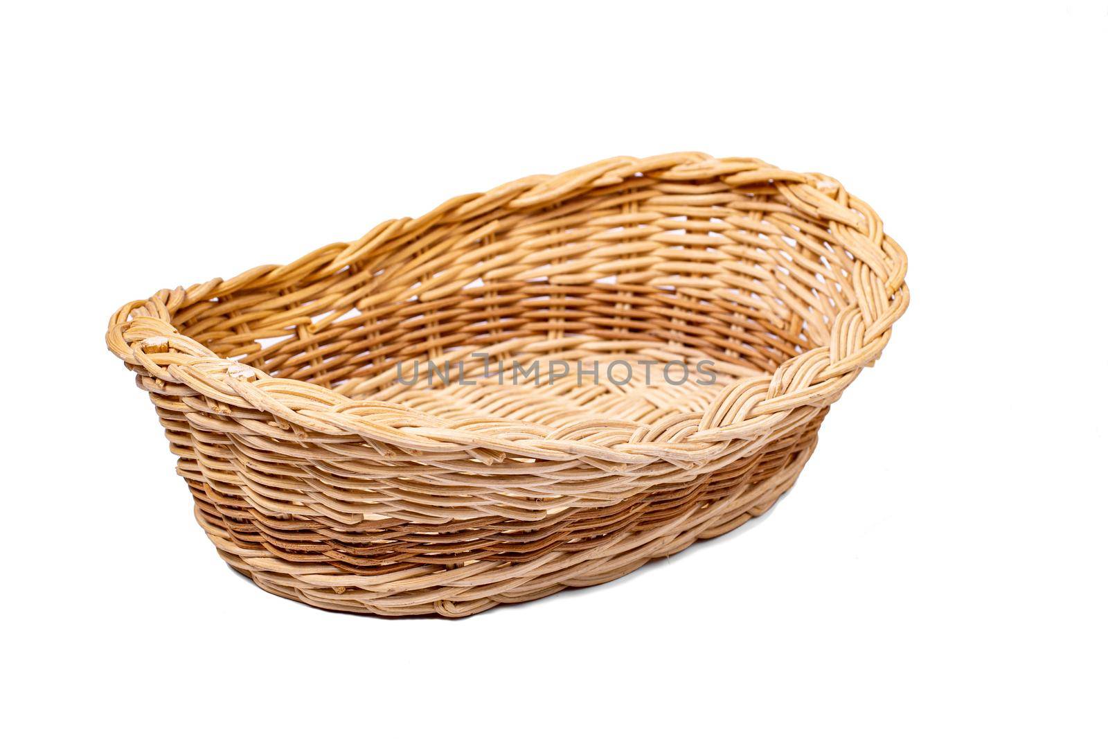 handmade wicker basket made of wooden rods, insulated on a white background