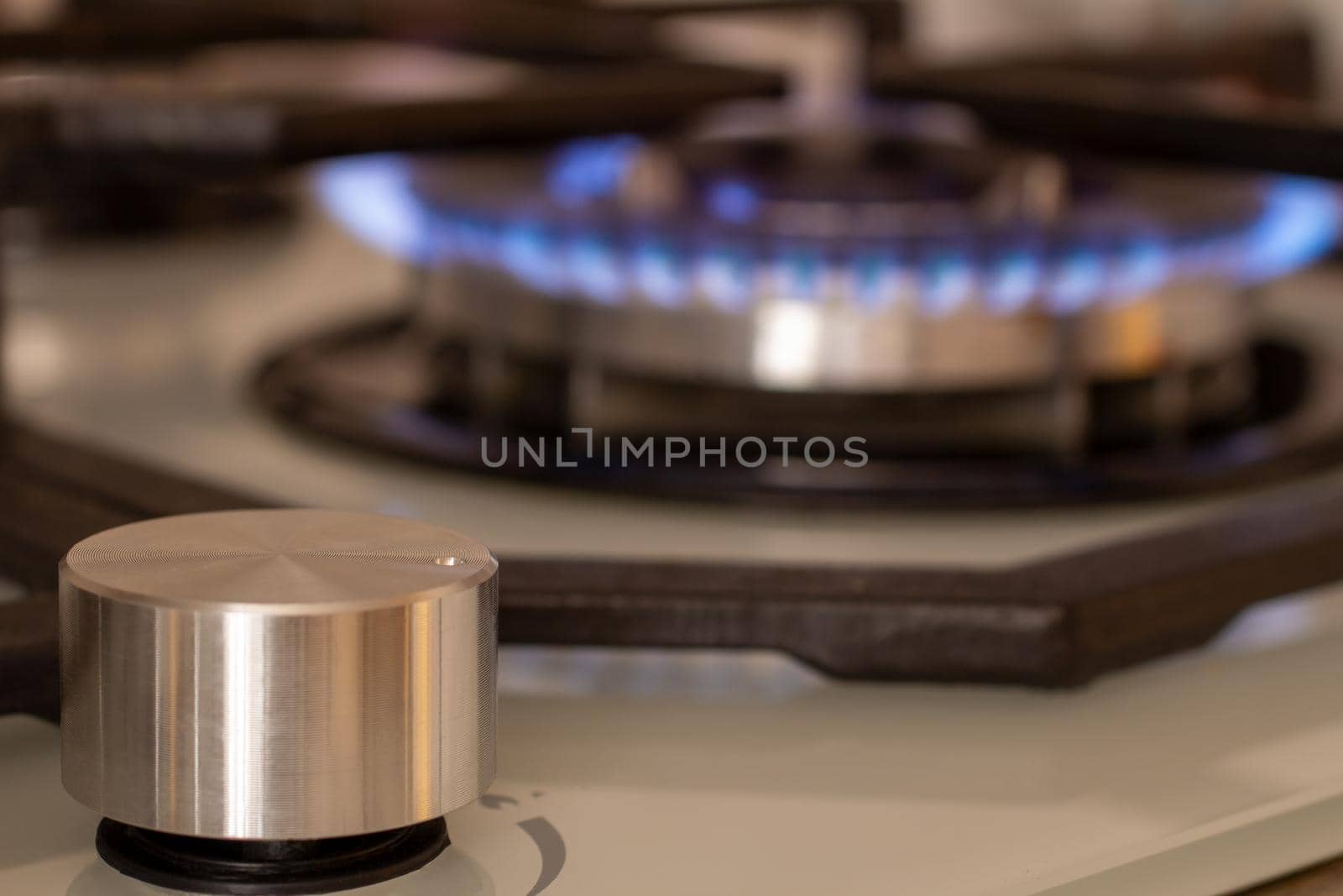 The blue flame of the gas burner. Kitchen stove. the selected focus.