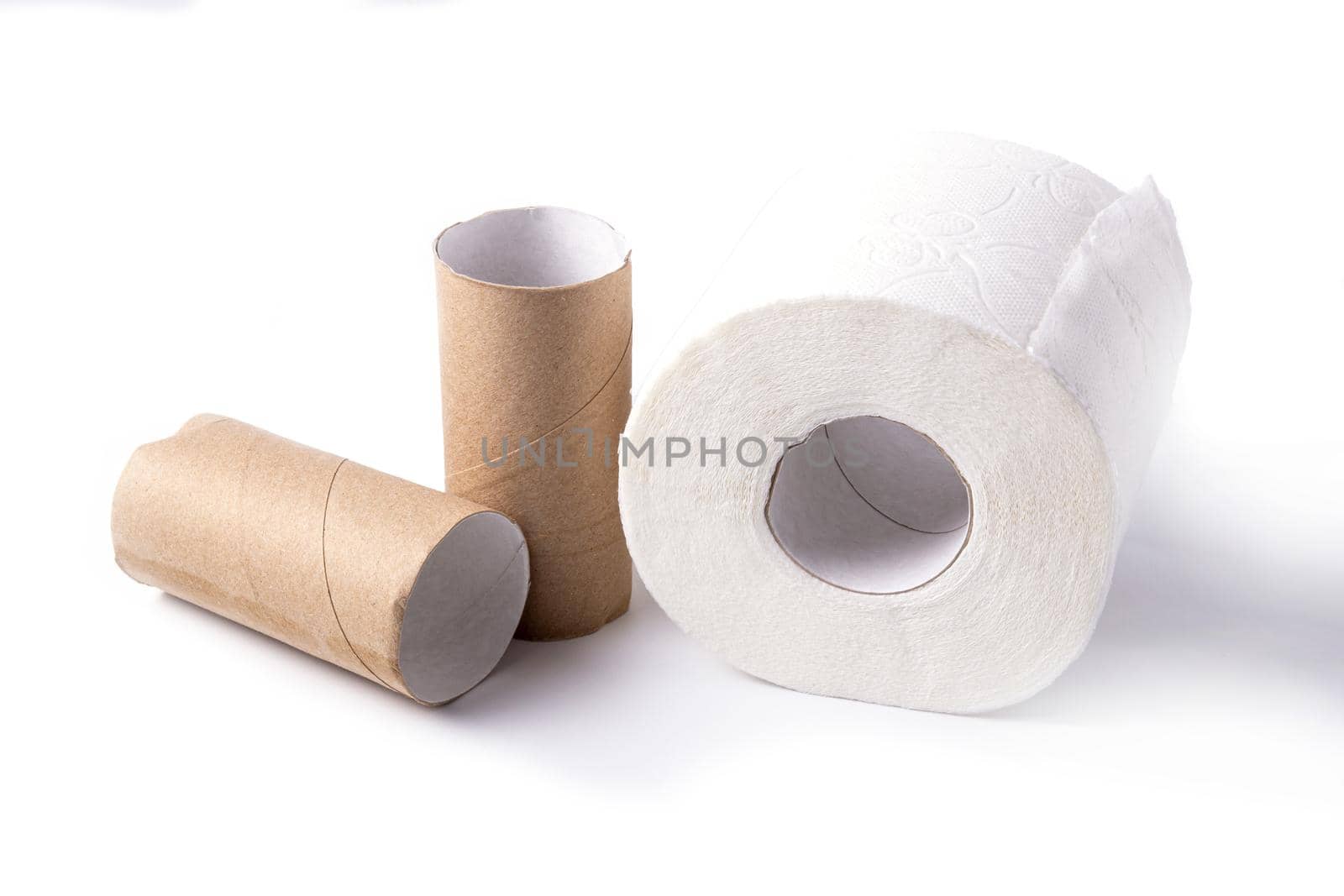 White whole roll of toilet paper and paper tubes on insulated on a white background.