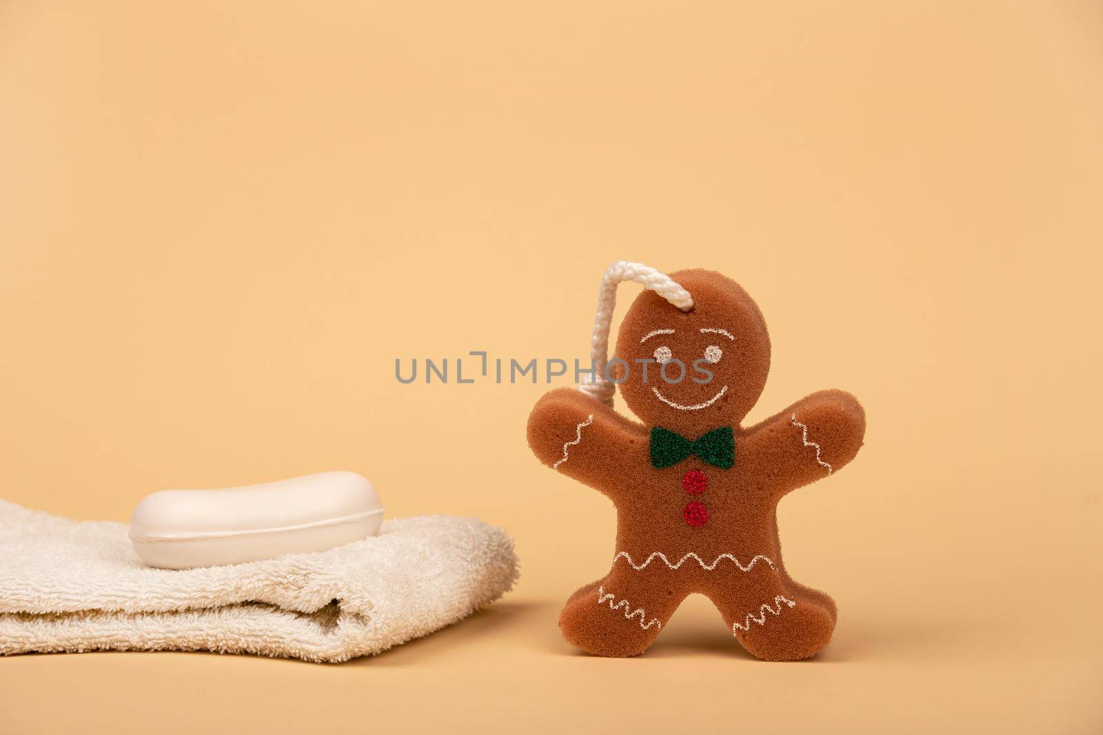Towel soap and washcloth in the form of a cheerful cookie for comfortable washing of the child. by bySergPo