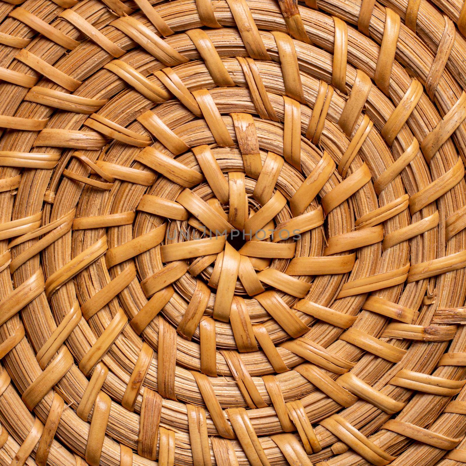 wicker circular basket pattern close-up. handmade