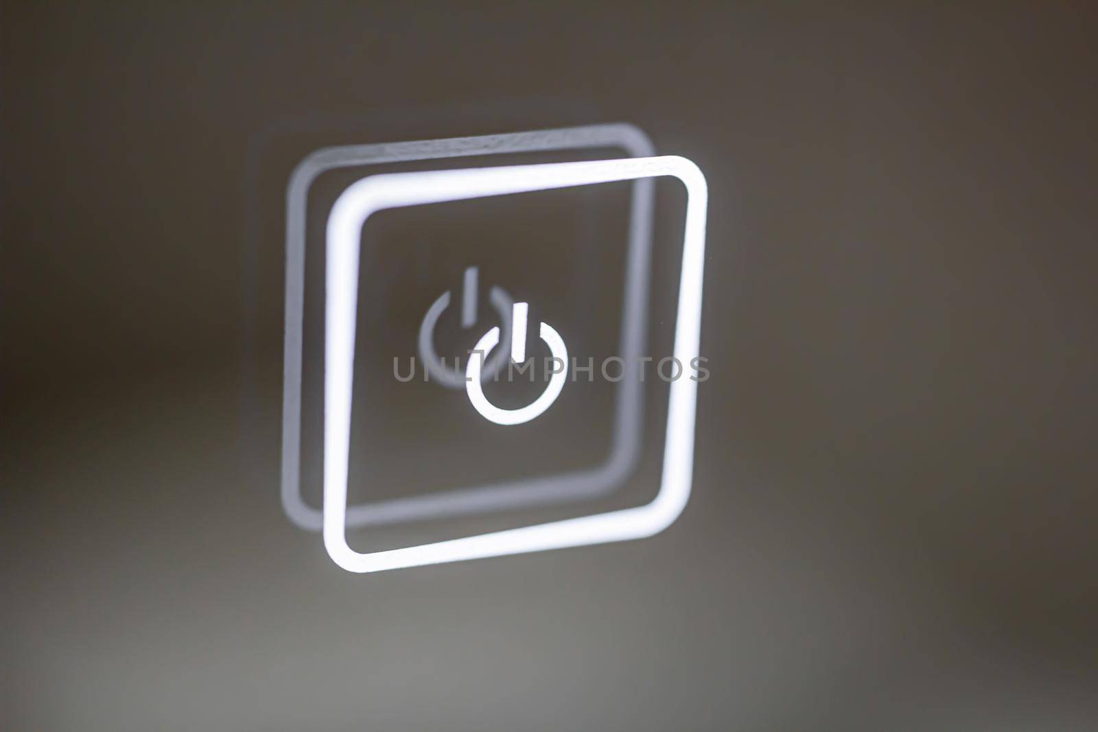 luminous touch button close-up. turn on off. by bySergPo