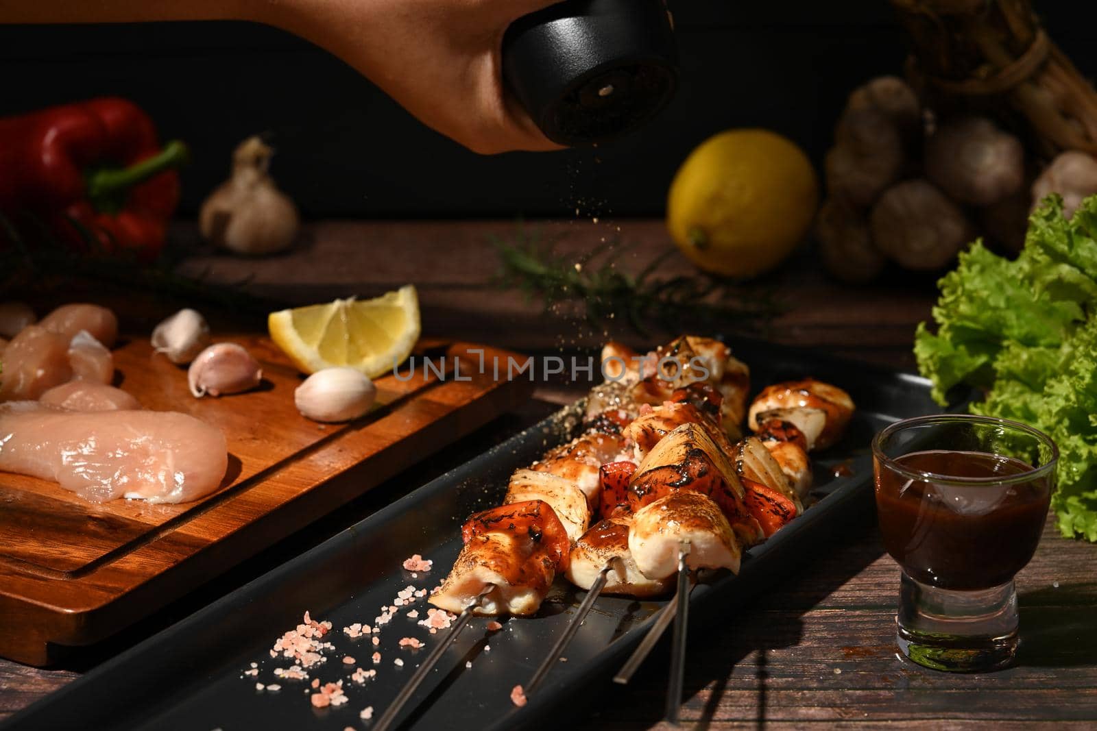 Grilled of chicken meat skewers cherry tomato and sweet pepper and onions in a ceramic plate. Barbecuing dinner.