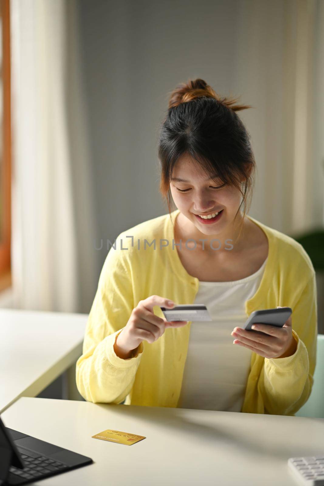 Young woman using mobile phone for shopping online, smart payment transaction money transfer technology purchasing product.