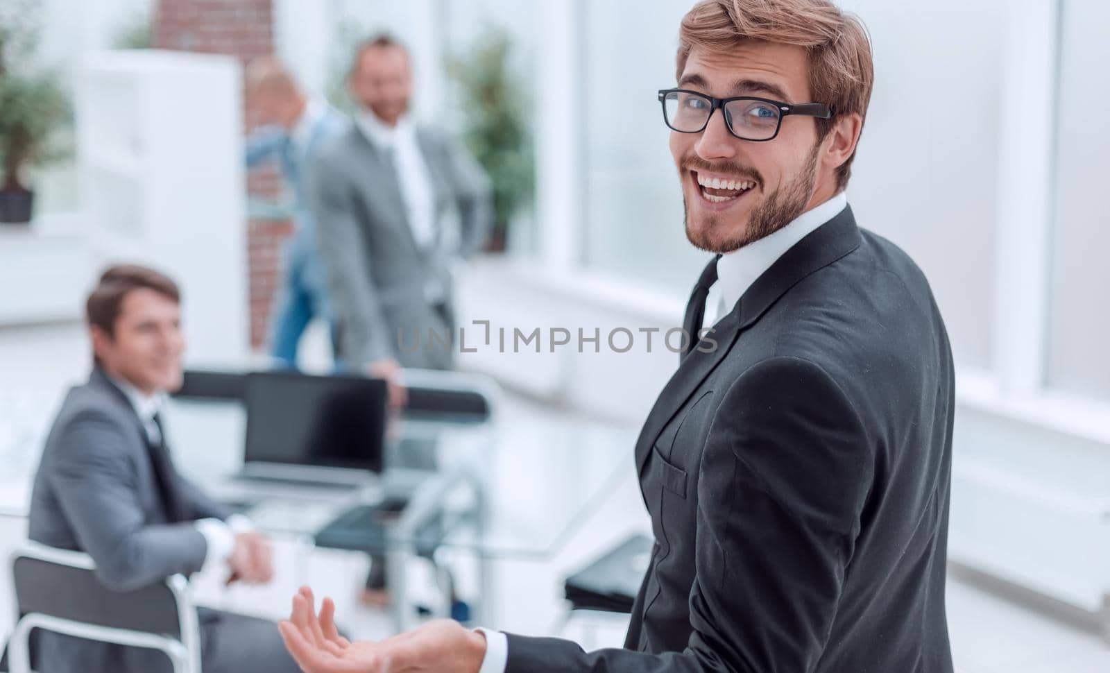close up. successful young businessman standing in the office