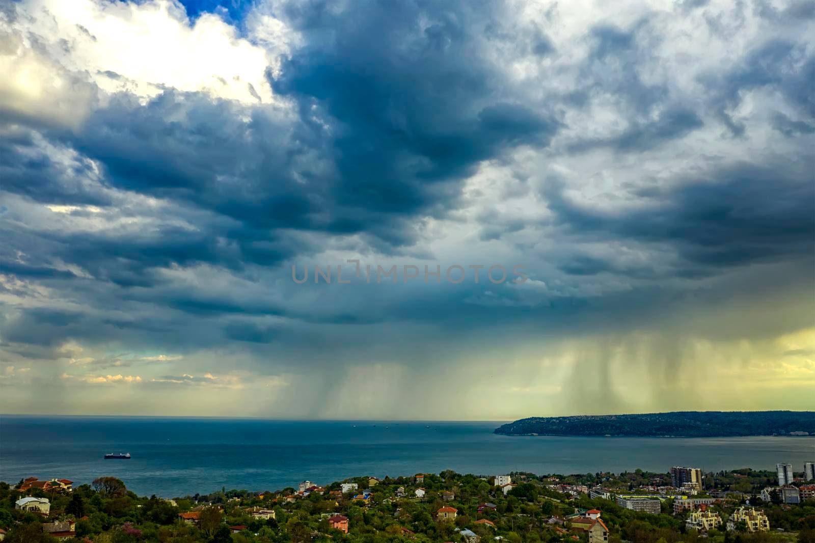 exciting stormy clouds and rain over the sea